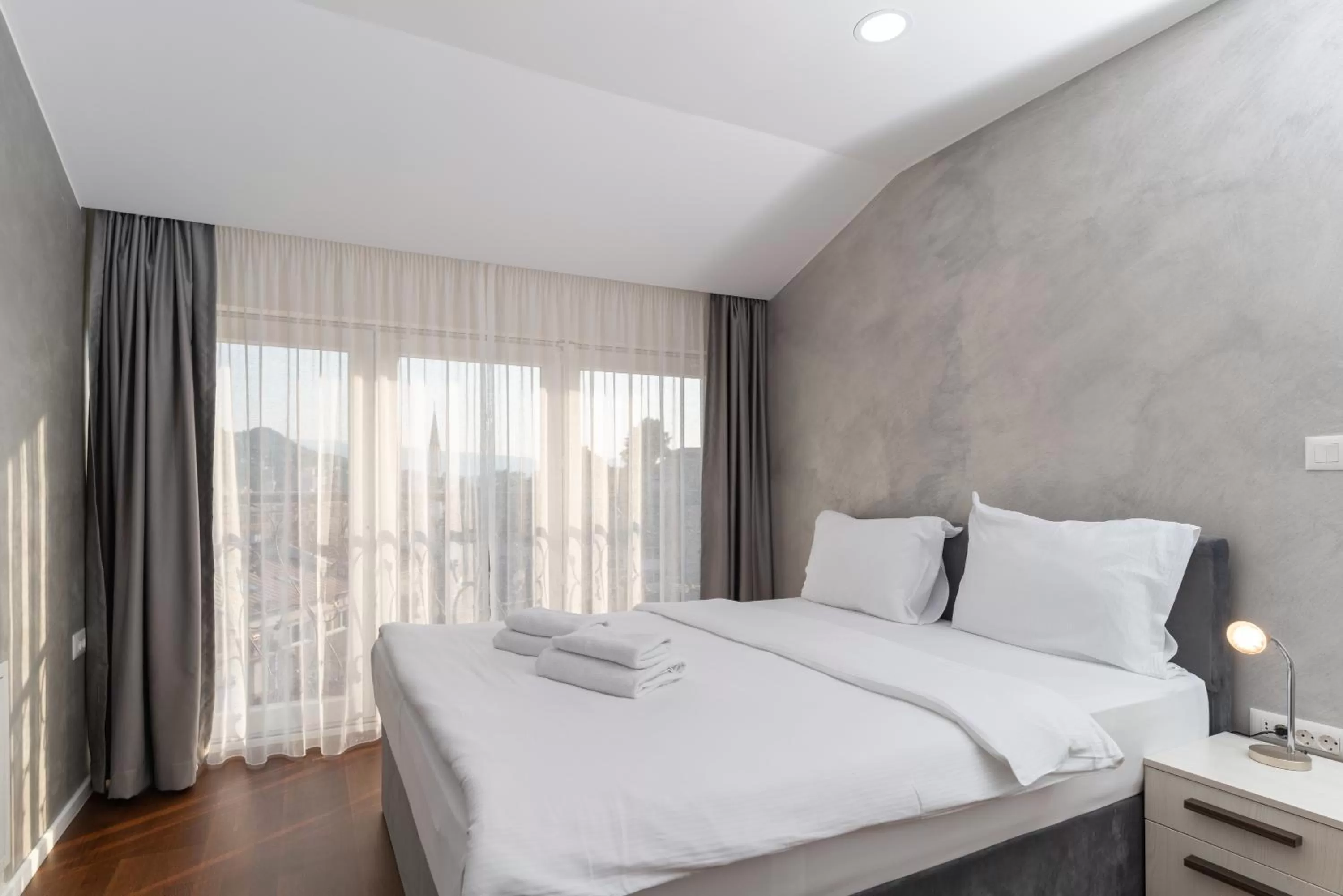 Bed in Ornament Hotel and Apartments