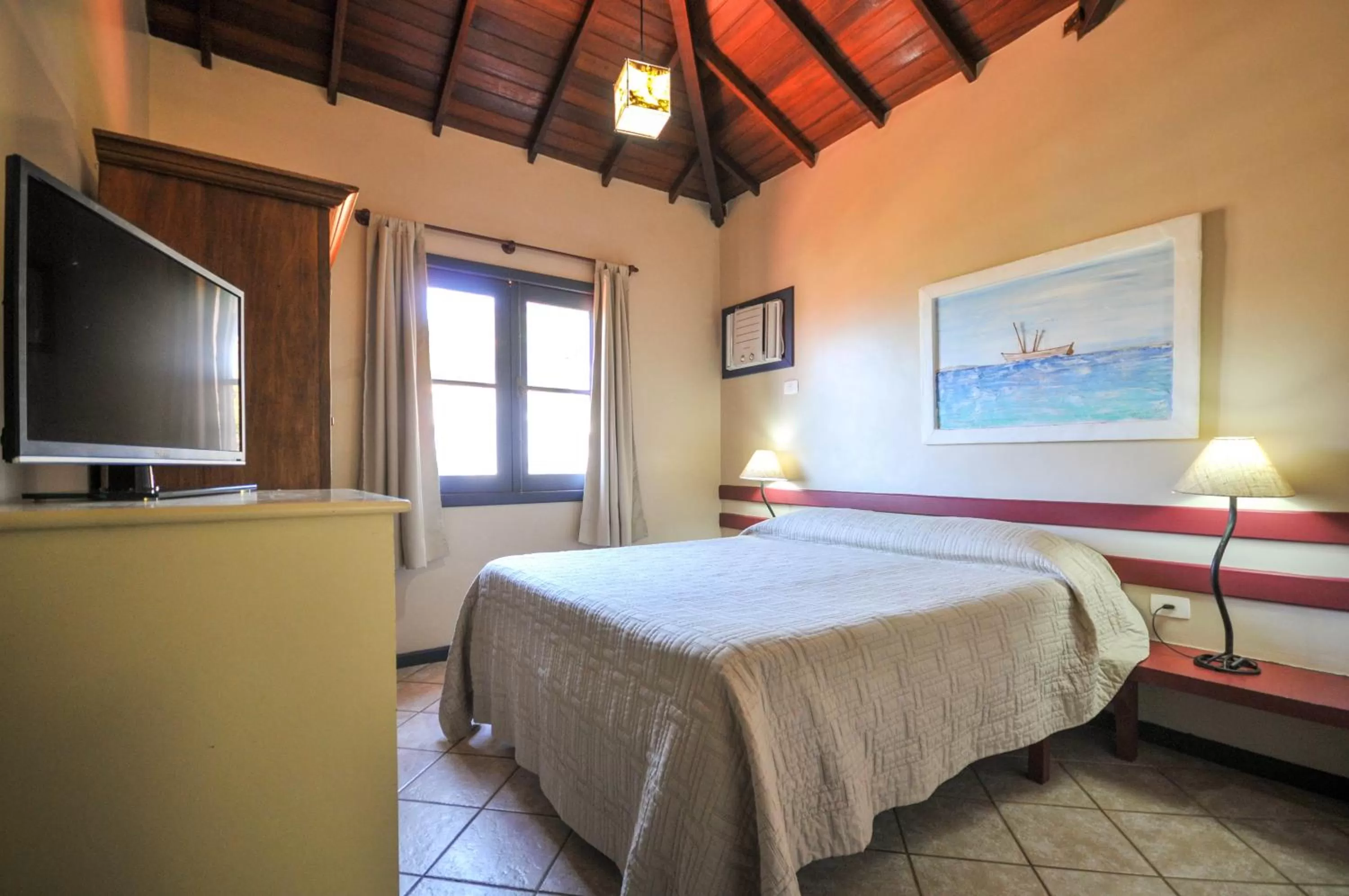 Bed in Aguabúzios Hotel