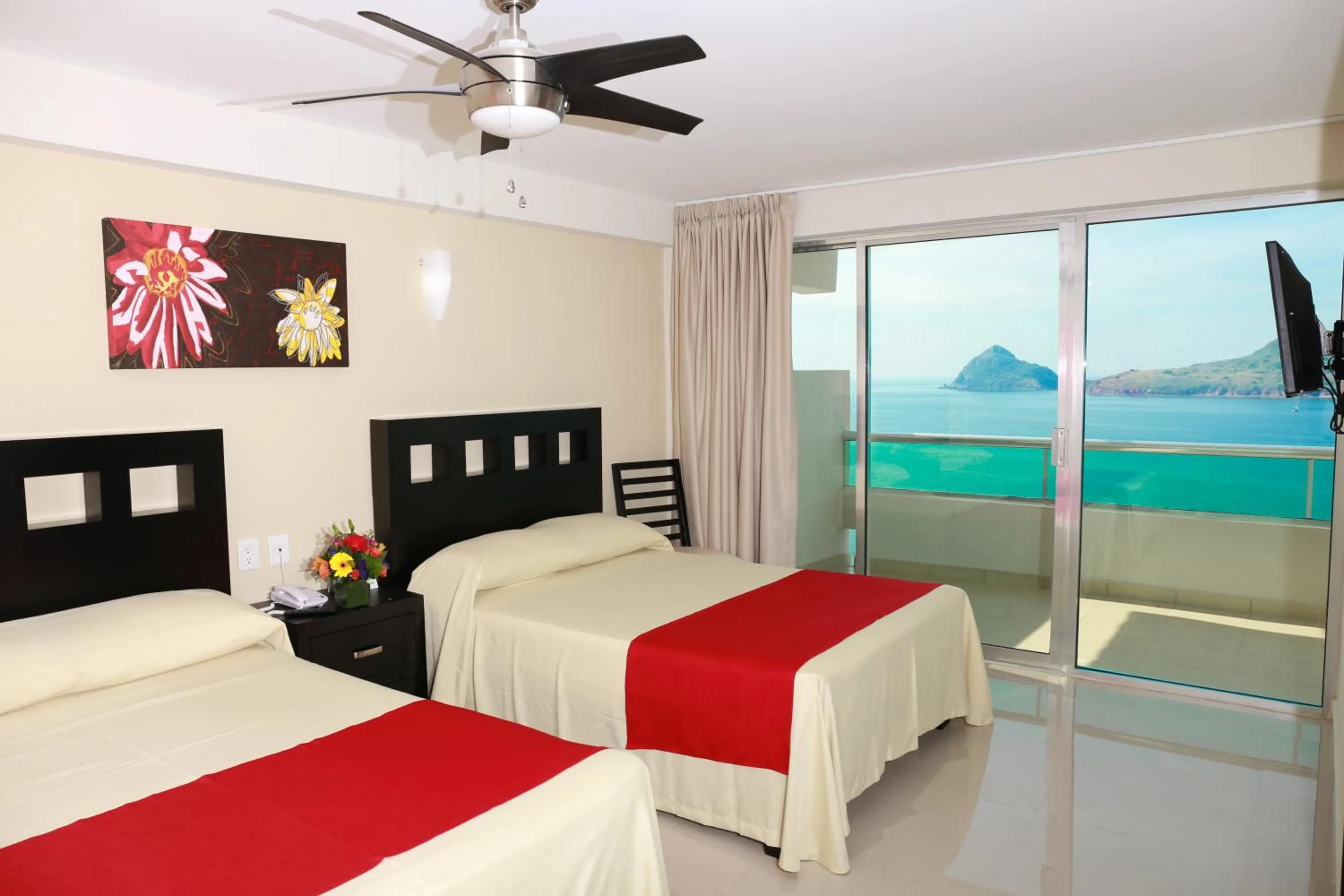 Photo of the whole room, Bed in Las Flores Beach Resort