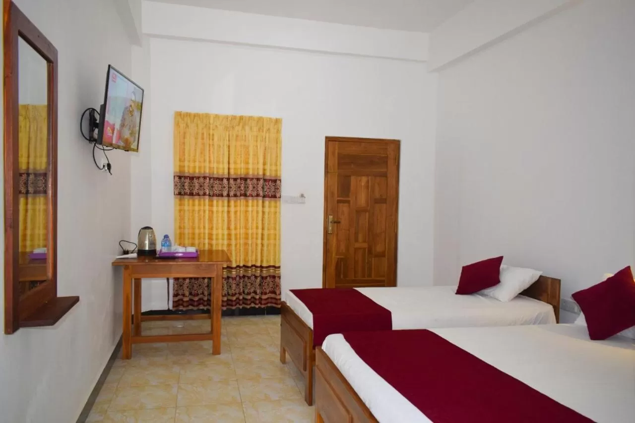 Bed in Hotel Theevanni Inn