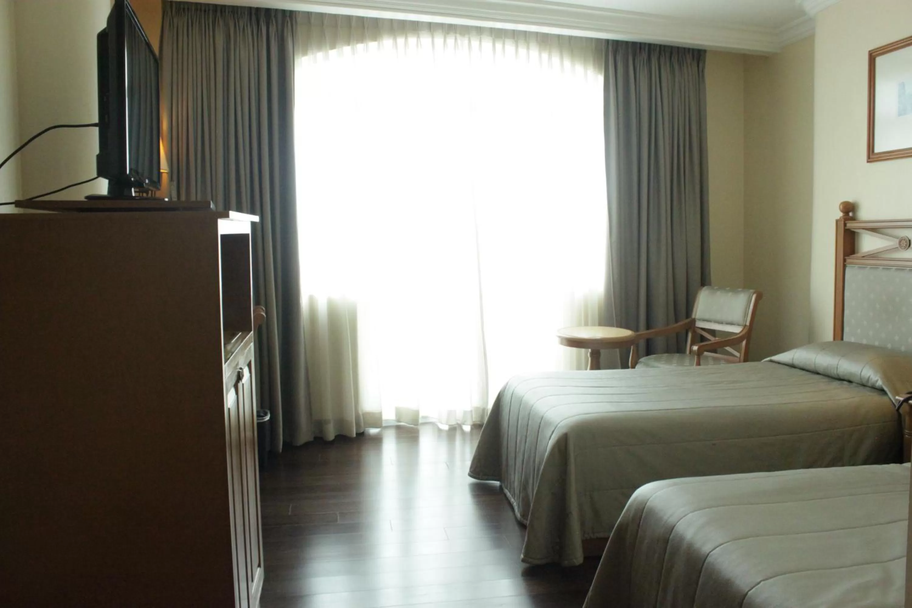 Bed in The Grand Dame Hotel