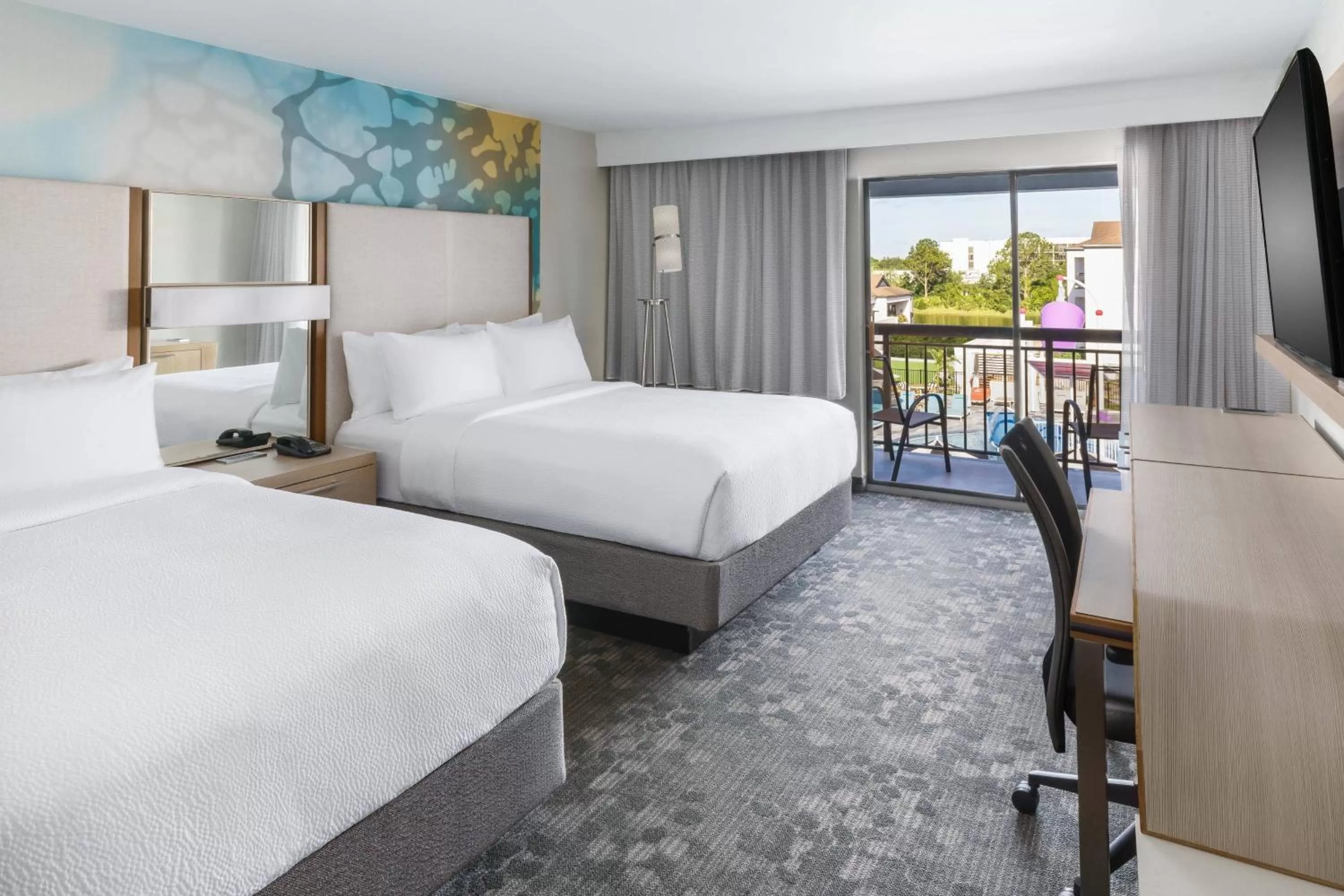 Queen Room with Two Queen Beds, Balcony and Pool View - Hearing Accessible in Courtyard by Marriott Orlando Lake Buena Vista at Vista Centre