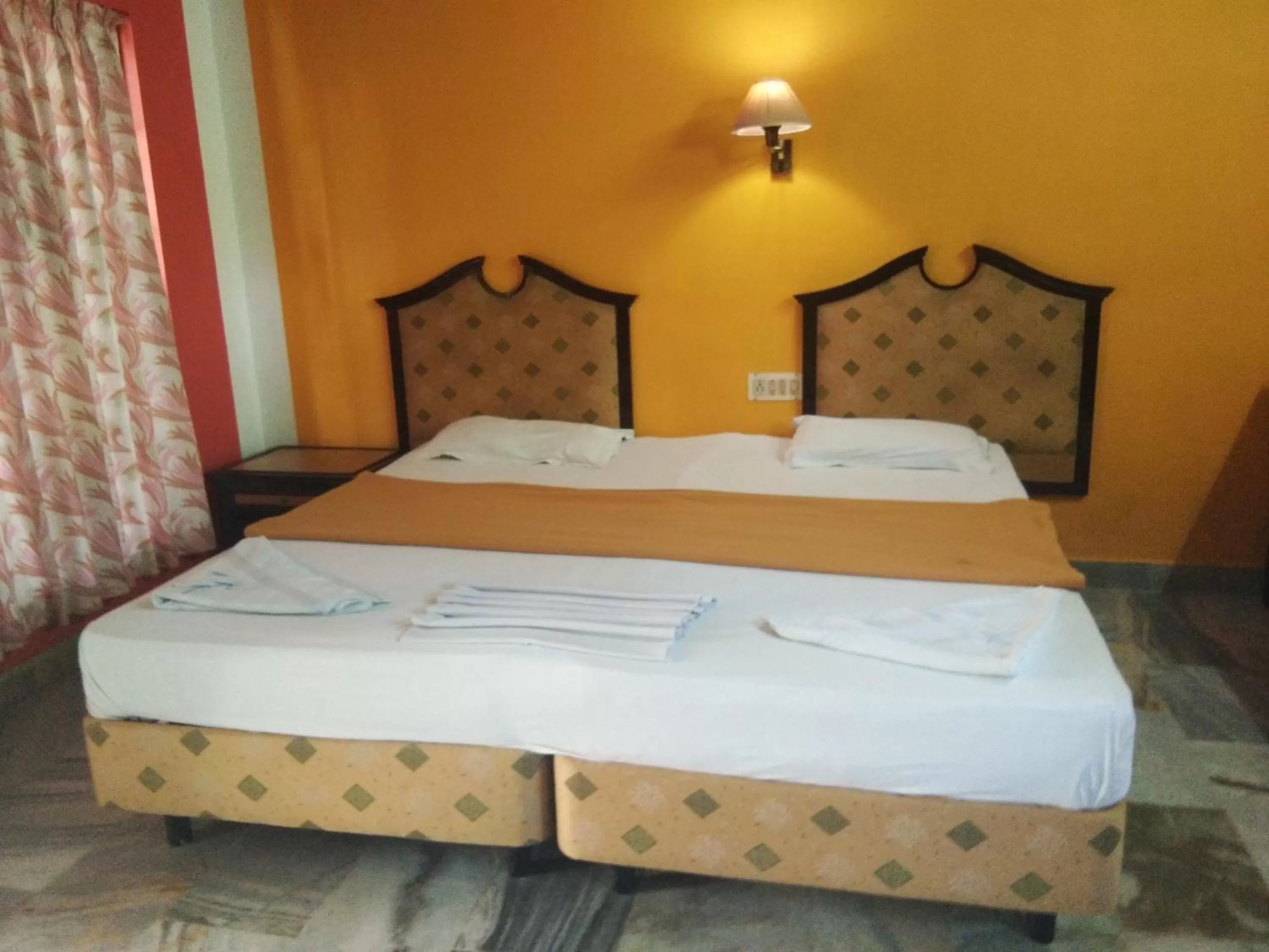 Bed in Wilson Ayurvedic Beach Resorts