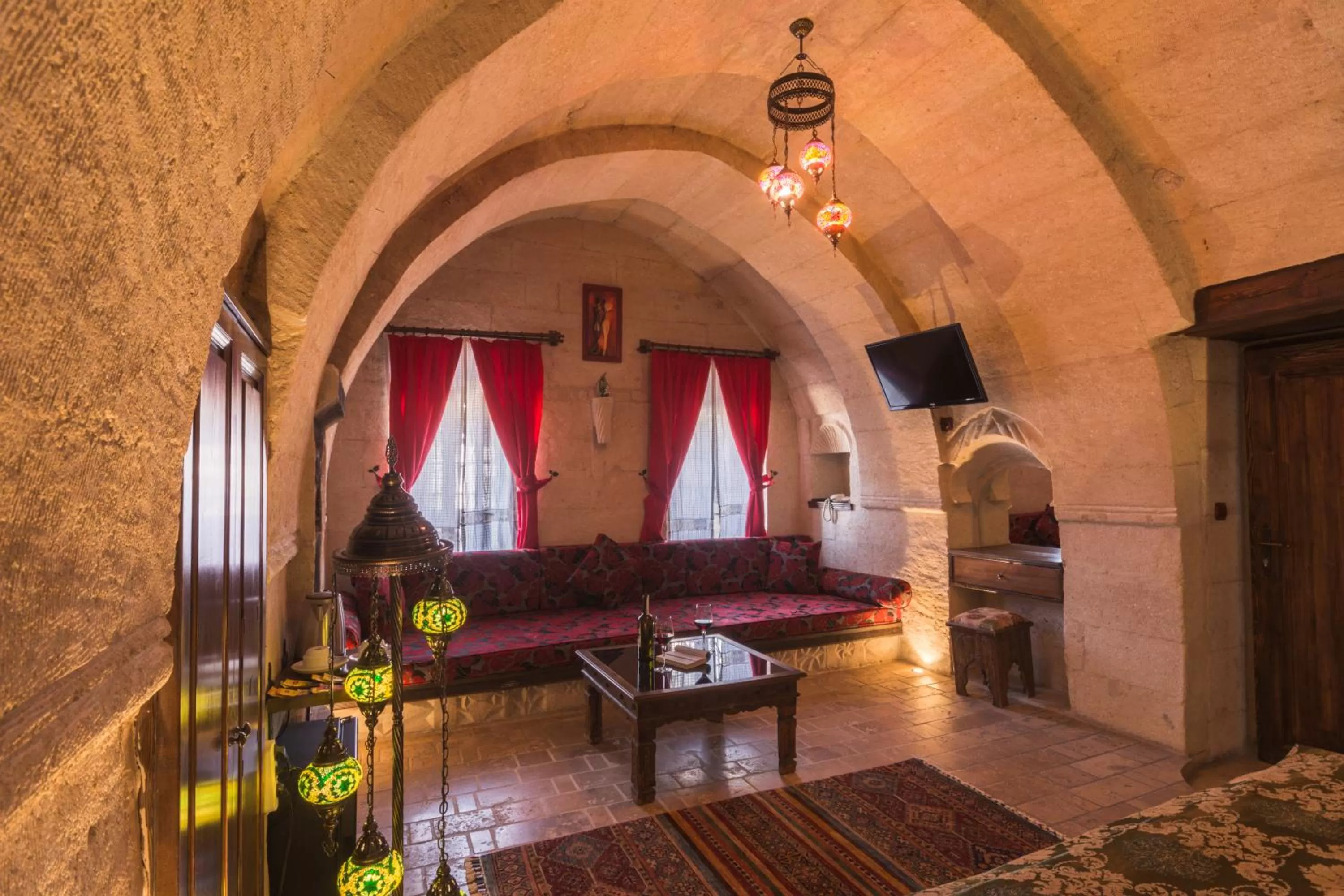 Seating area, Bed in Adora Cave Suites -