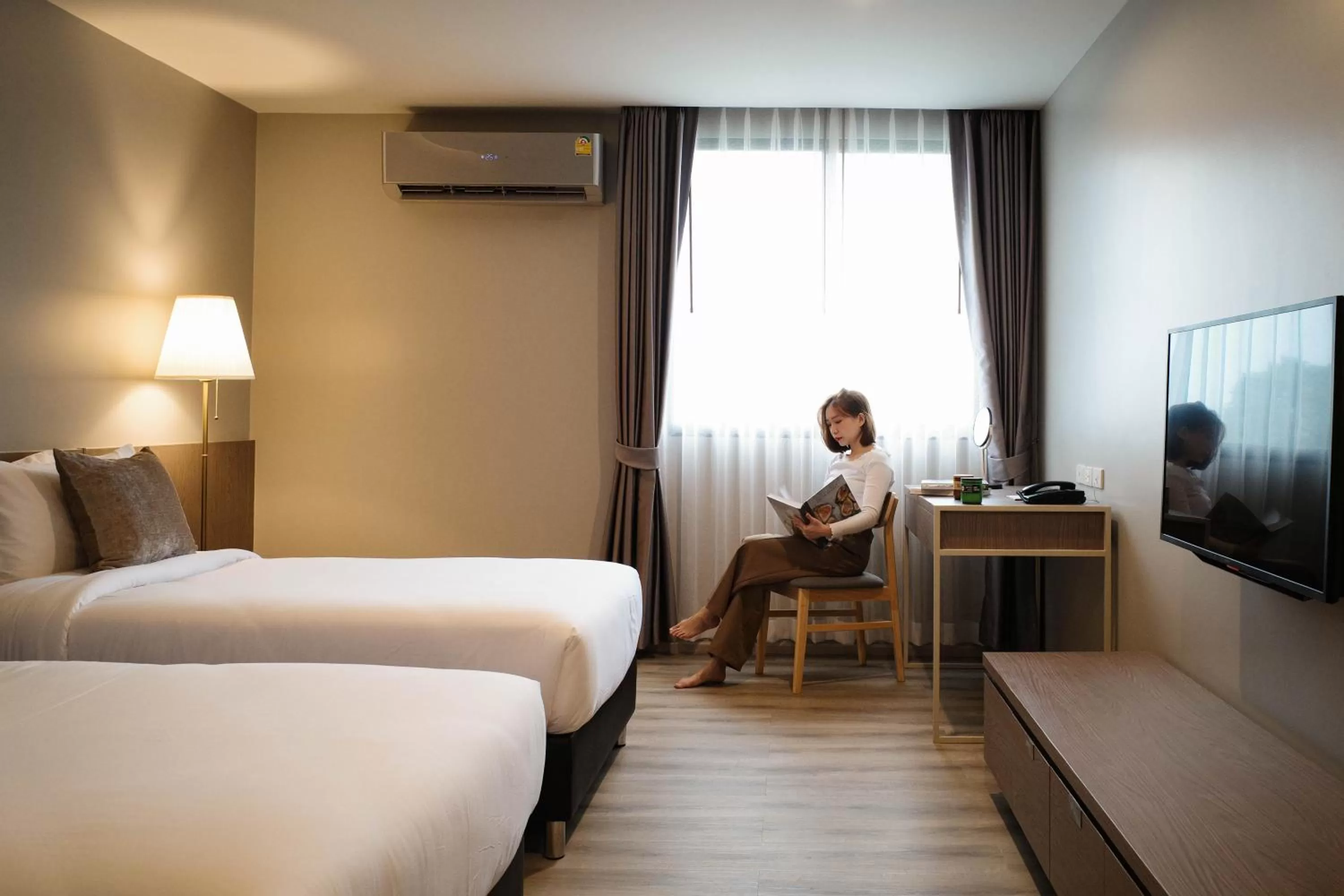 Photo of the whole room, Bed in The Rise Suites Hotel, Chiang Mai - SHA Extra Plus