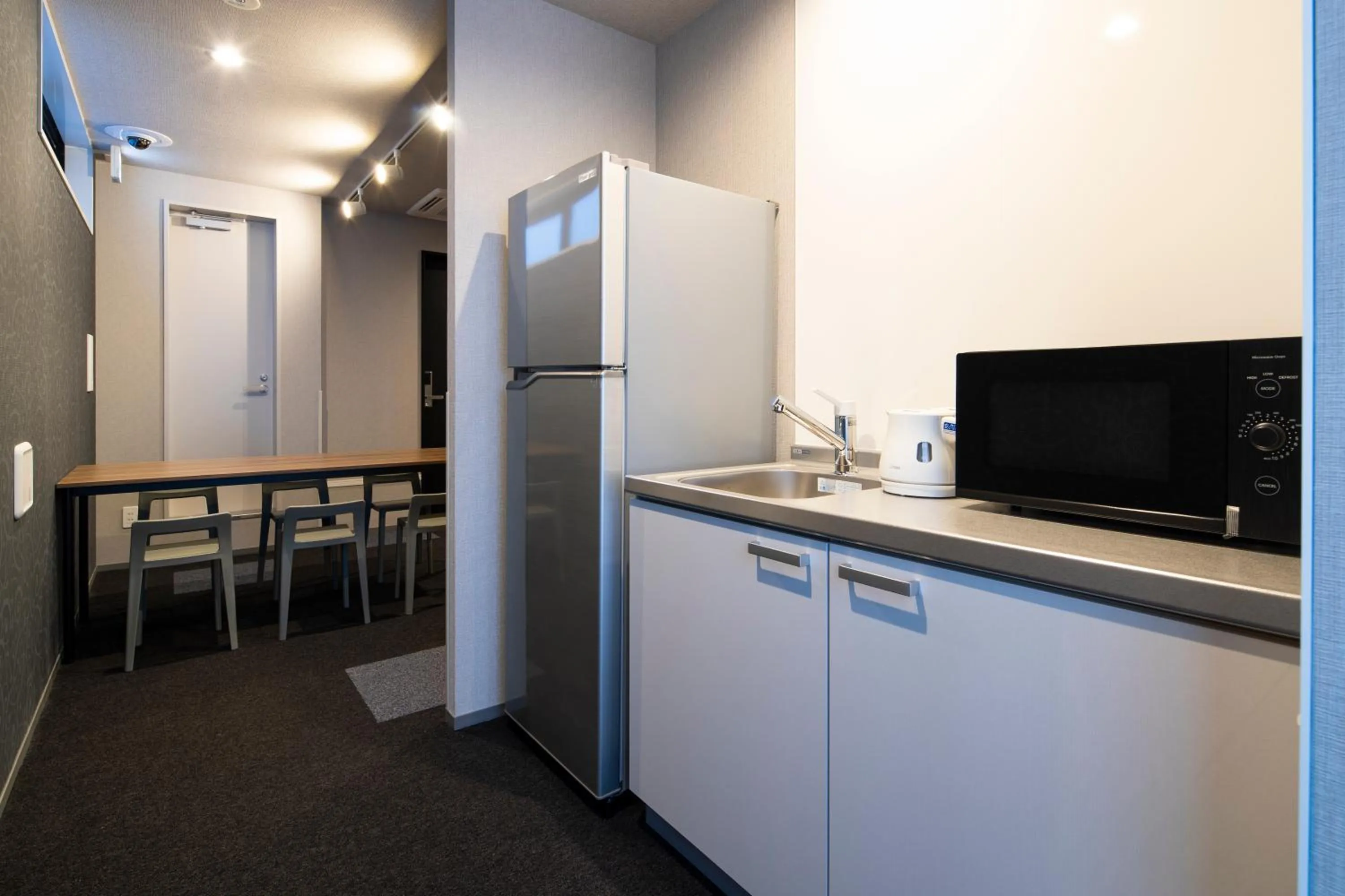 Communal kitchen in IMANO OSAKA SHINSAIBASHI HOSTEL