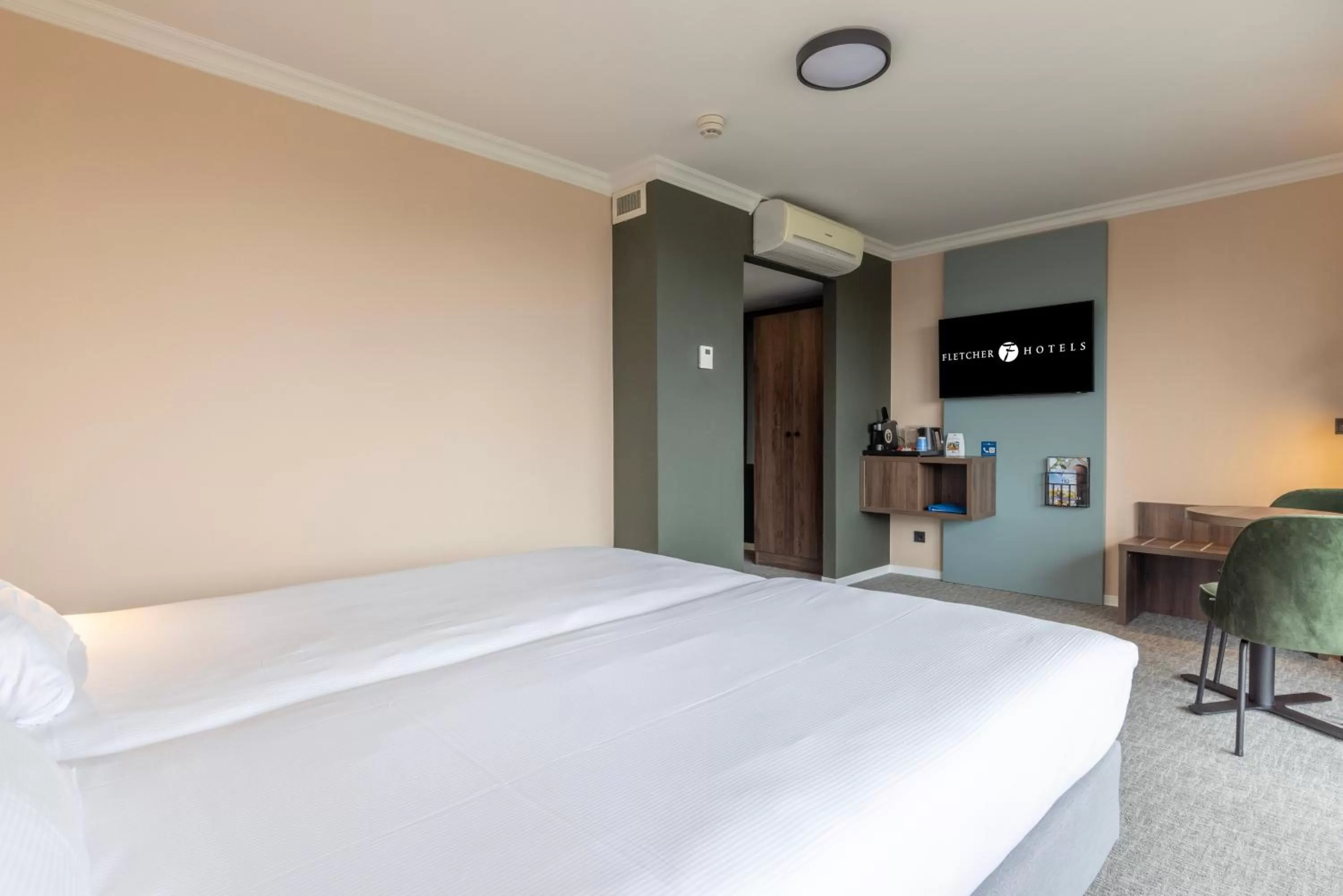 Bed in Fletcher Familiehotel De Hunzebergen