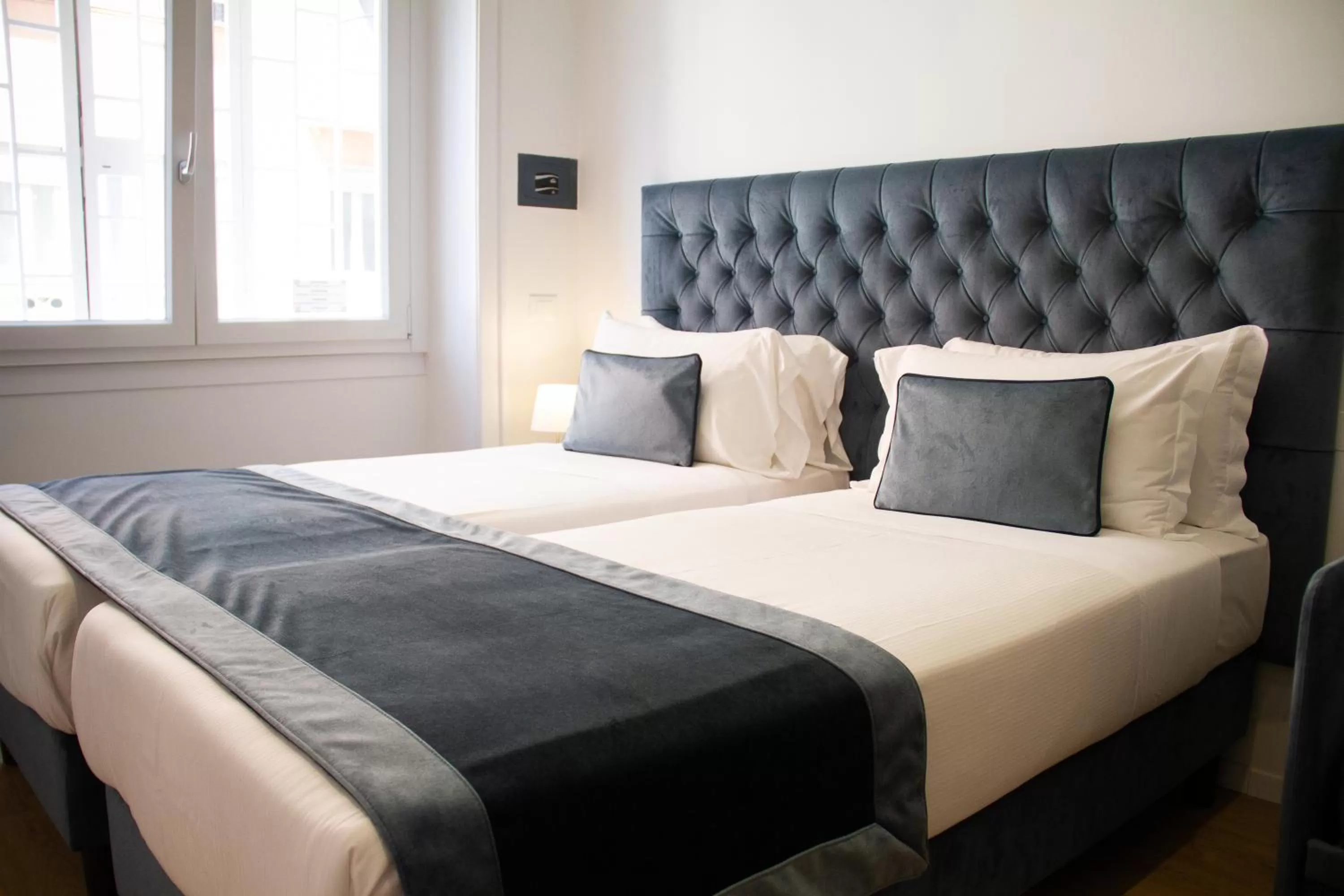 Bed in Michelangelo Vatican Rooms