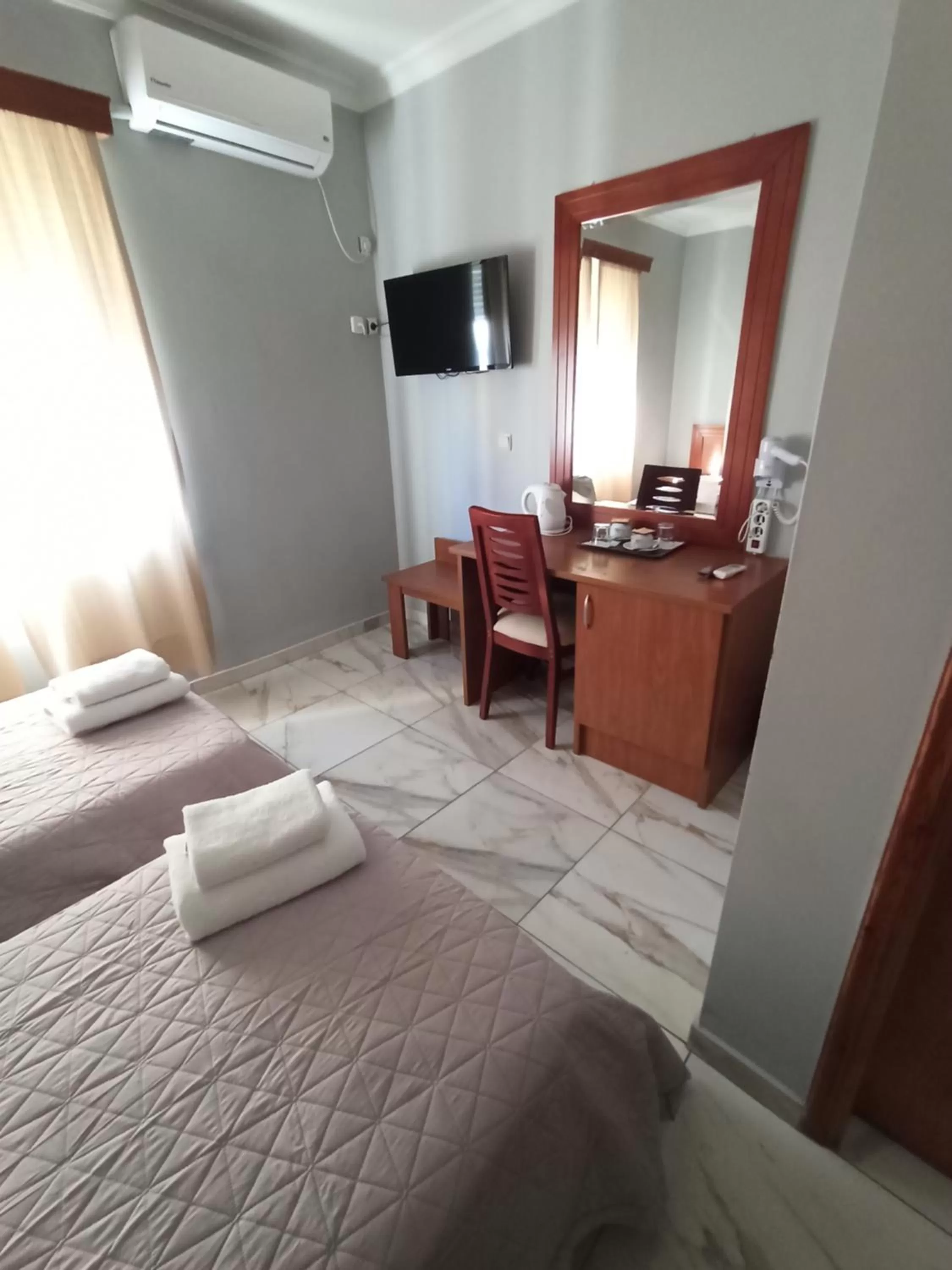 Bedroom, TV/Entertainment Center in Piraeus Acropole Hotel