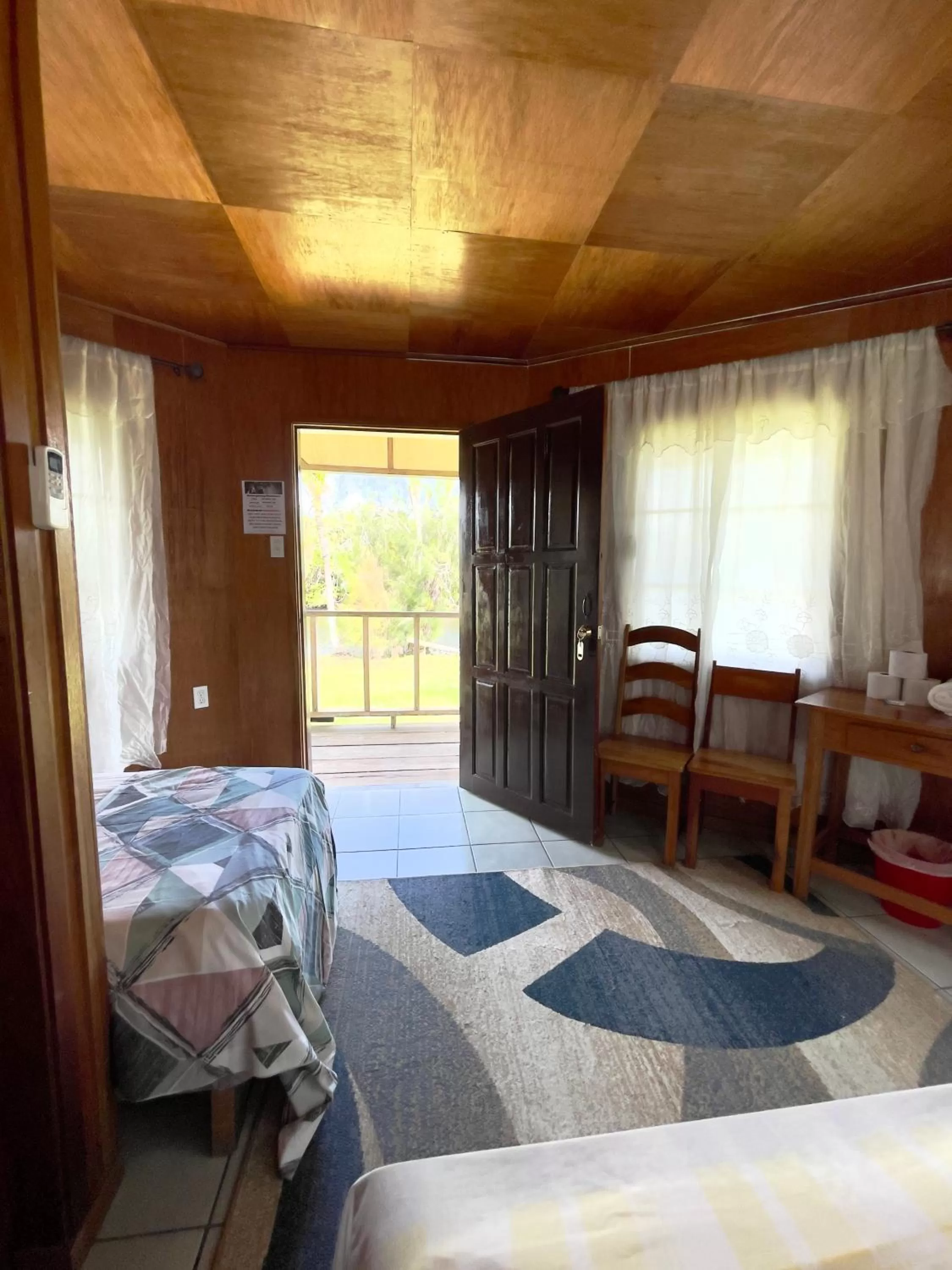 Bed in Lamanai Riverside Retreat