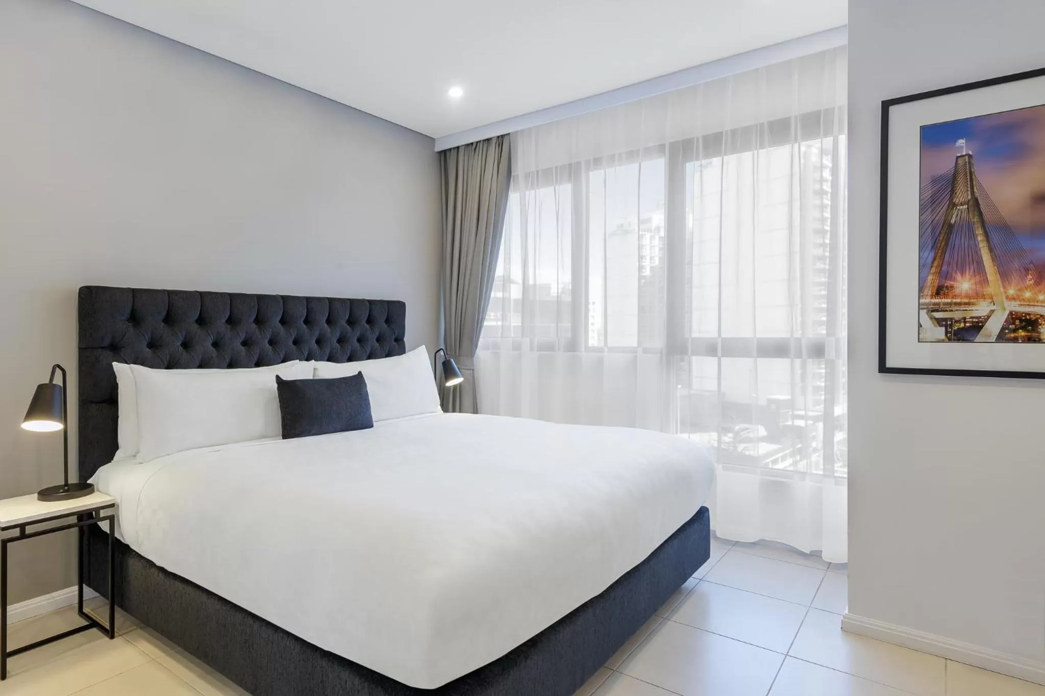 Bed in Meriton Suites Kent Street, Sydney