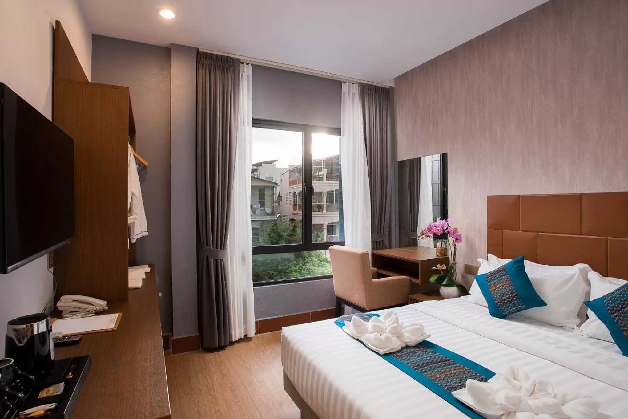 Photo of the whole room, Bed in Orussey One Boutique