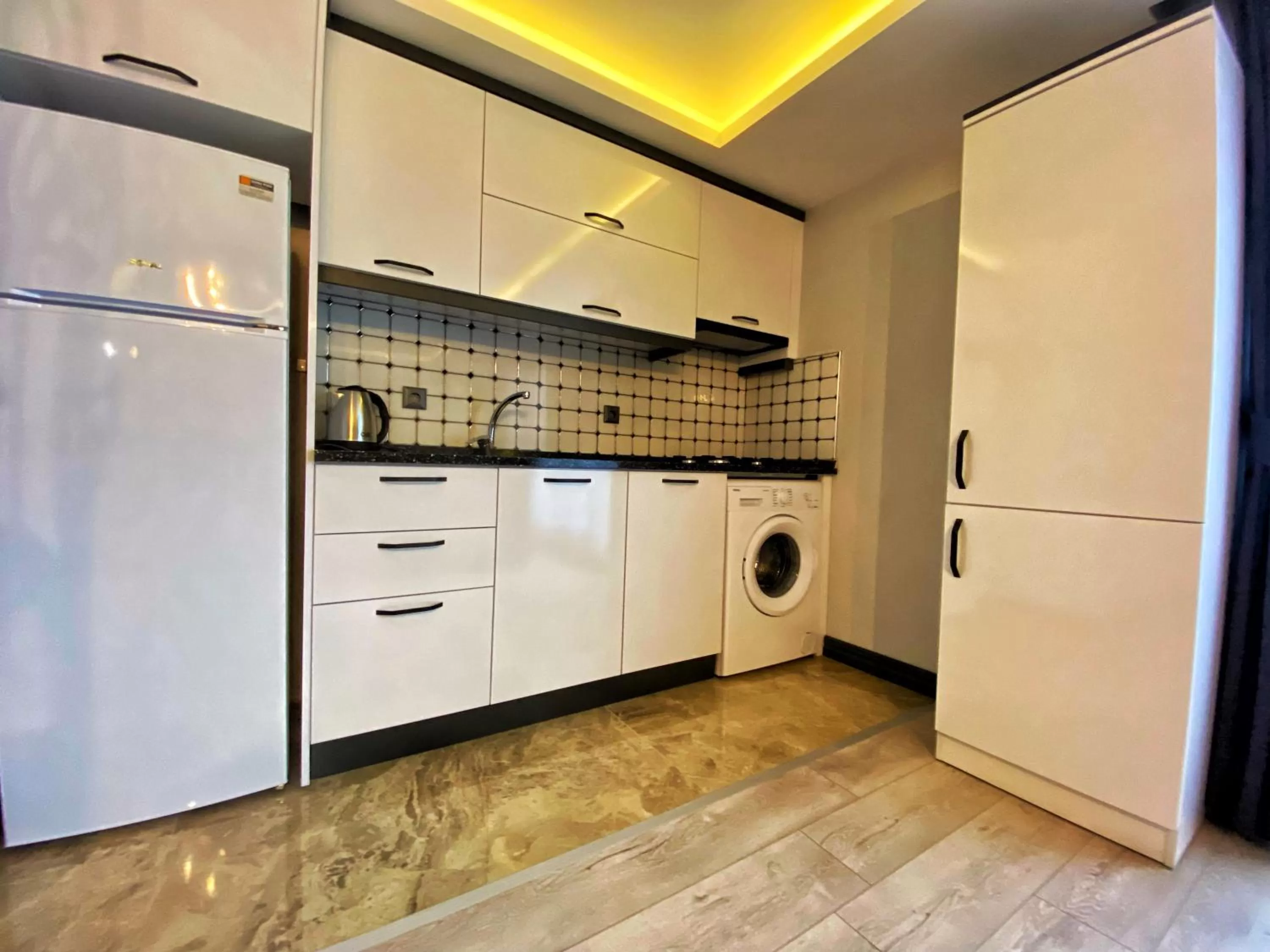 Communal kitchen in My House Suite