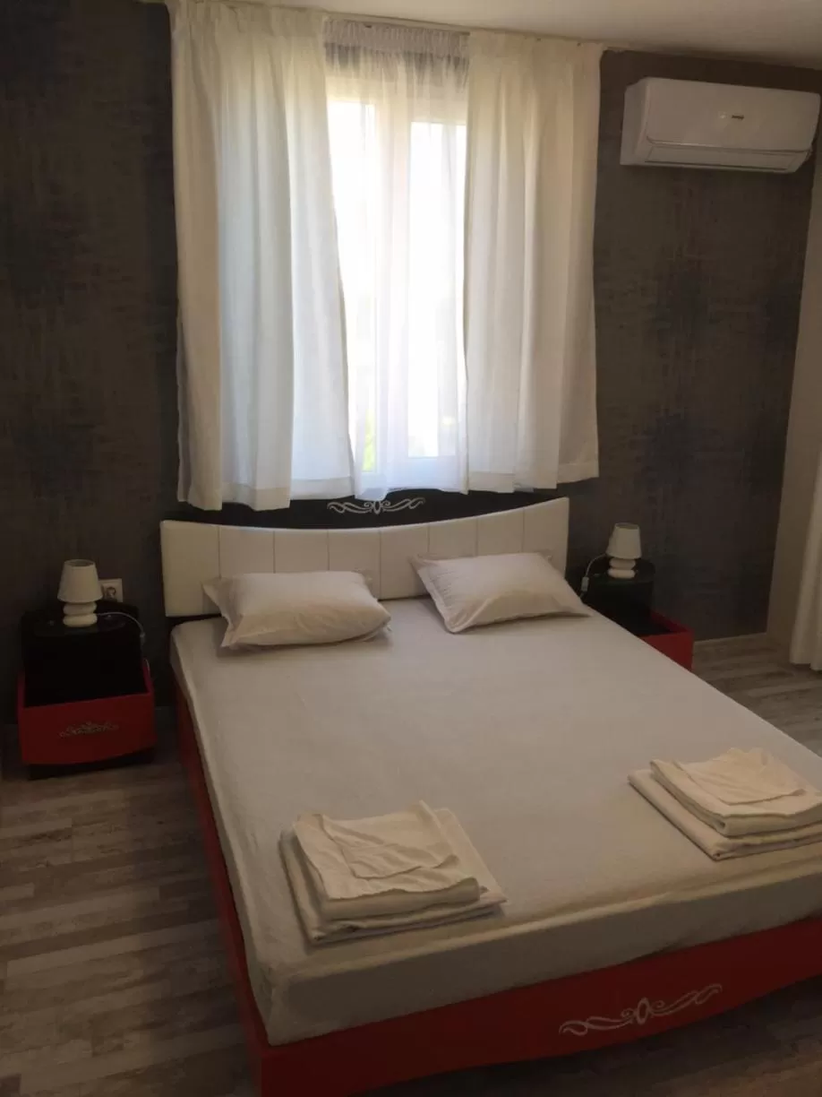 Bed in Family Hotel Malibu