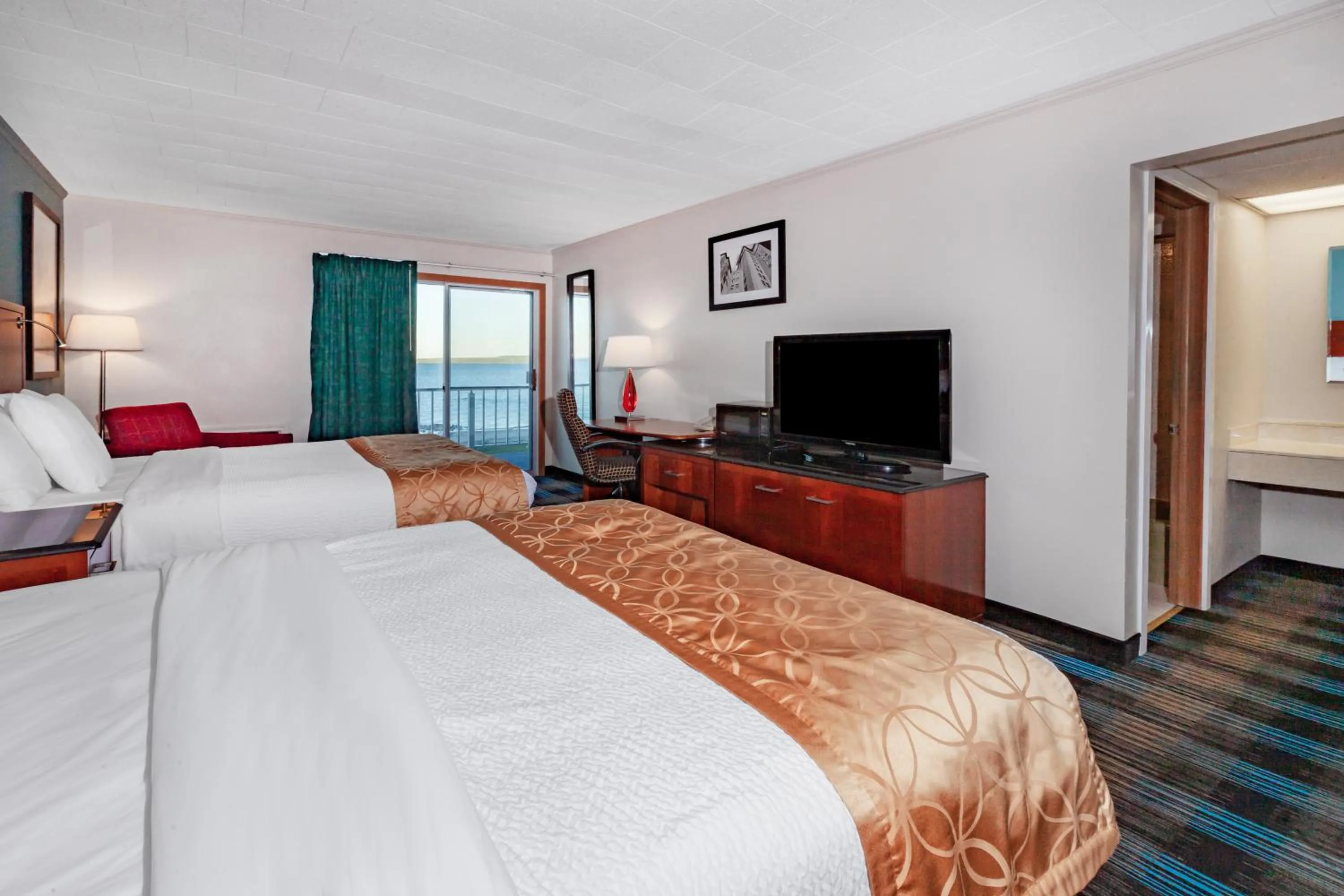 Bed in Days Inn & Suites by Wyndham St. Ignace Lakefront