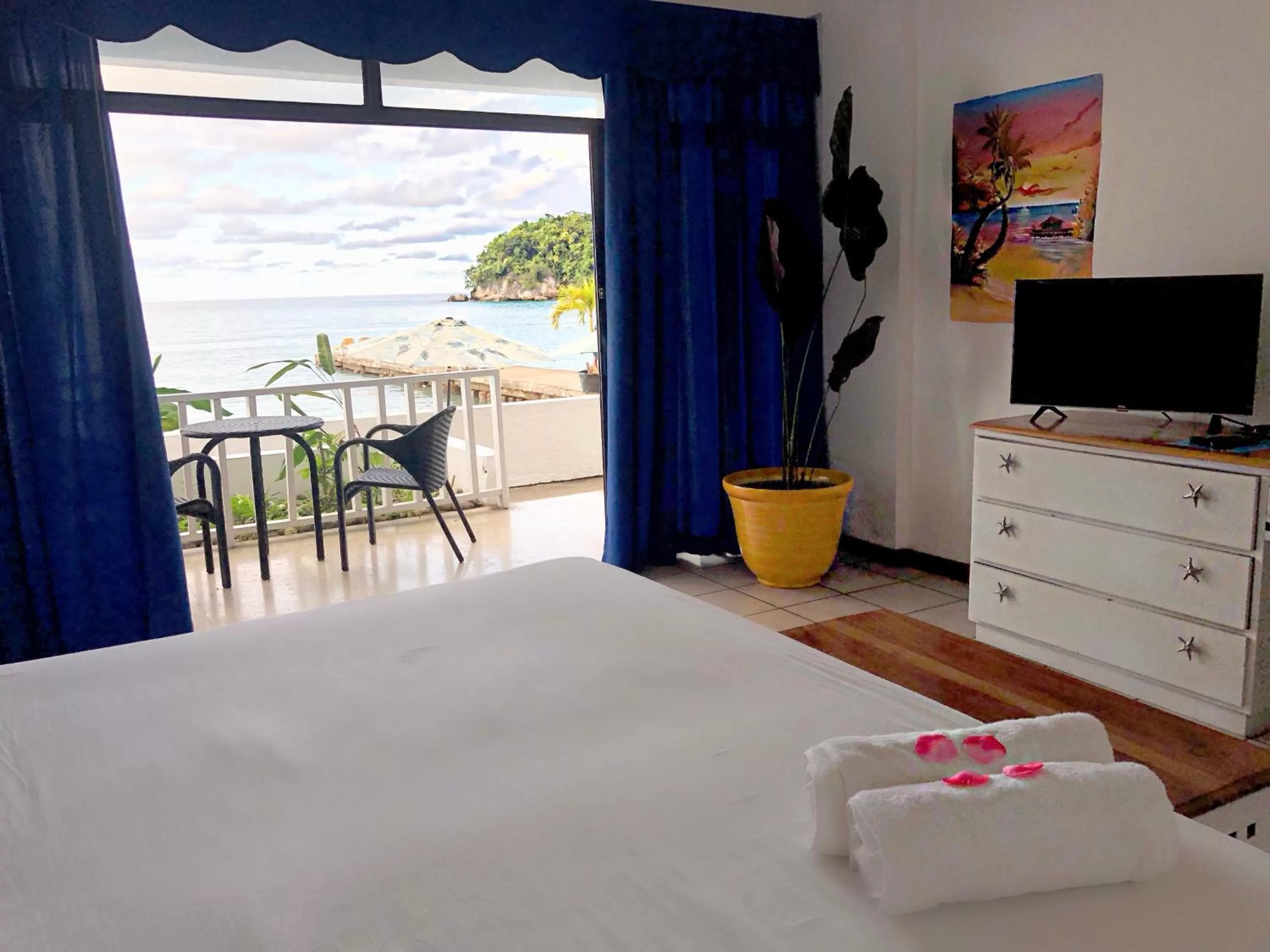 Bed in Sand and Tan Beach Hotel