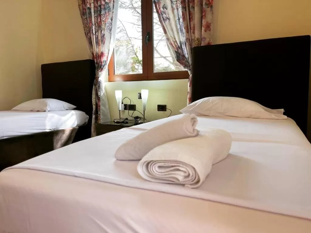 Bed in Hotel Ambasador