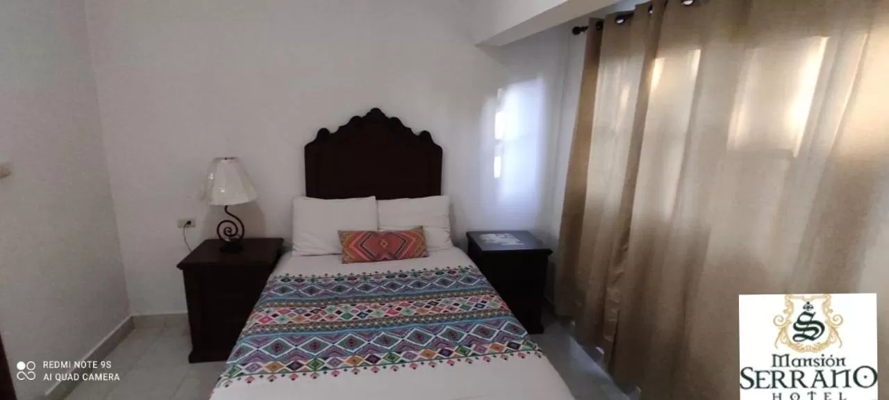 Bed in Mansion Serrano Hotel