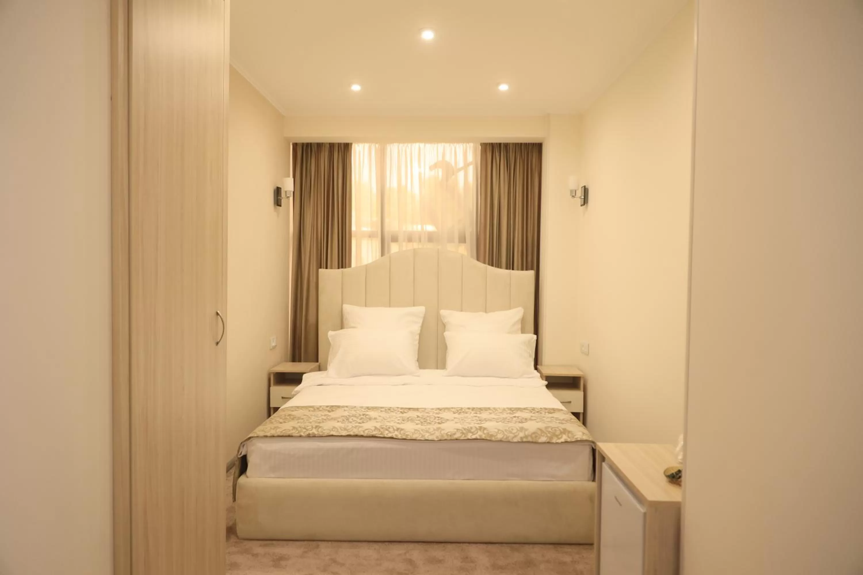 Bed in DeLin Hotel And Tours