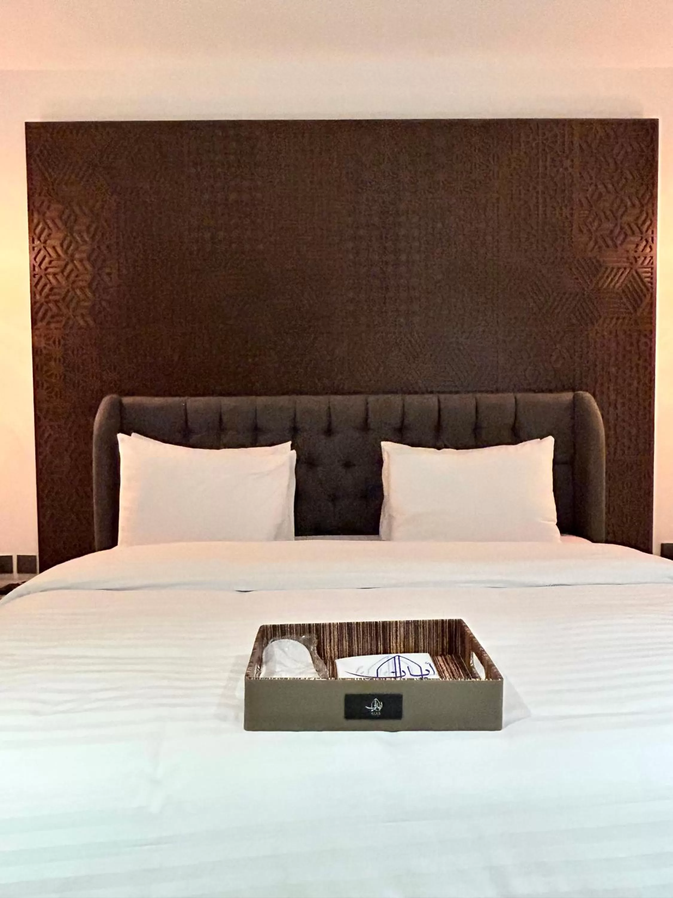 Bed in Tajreed Suites