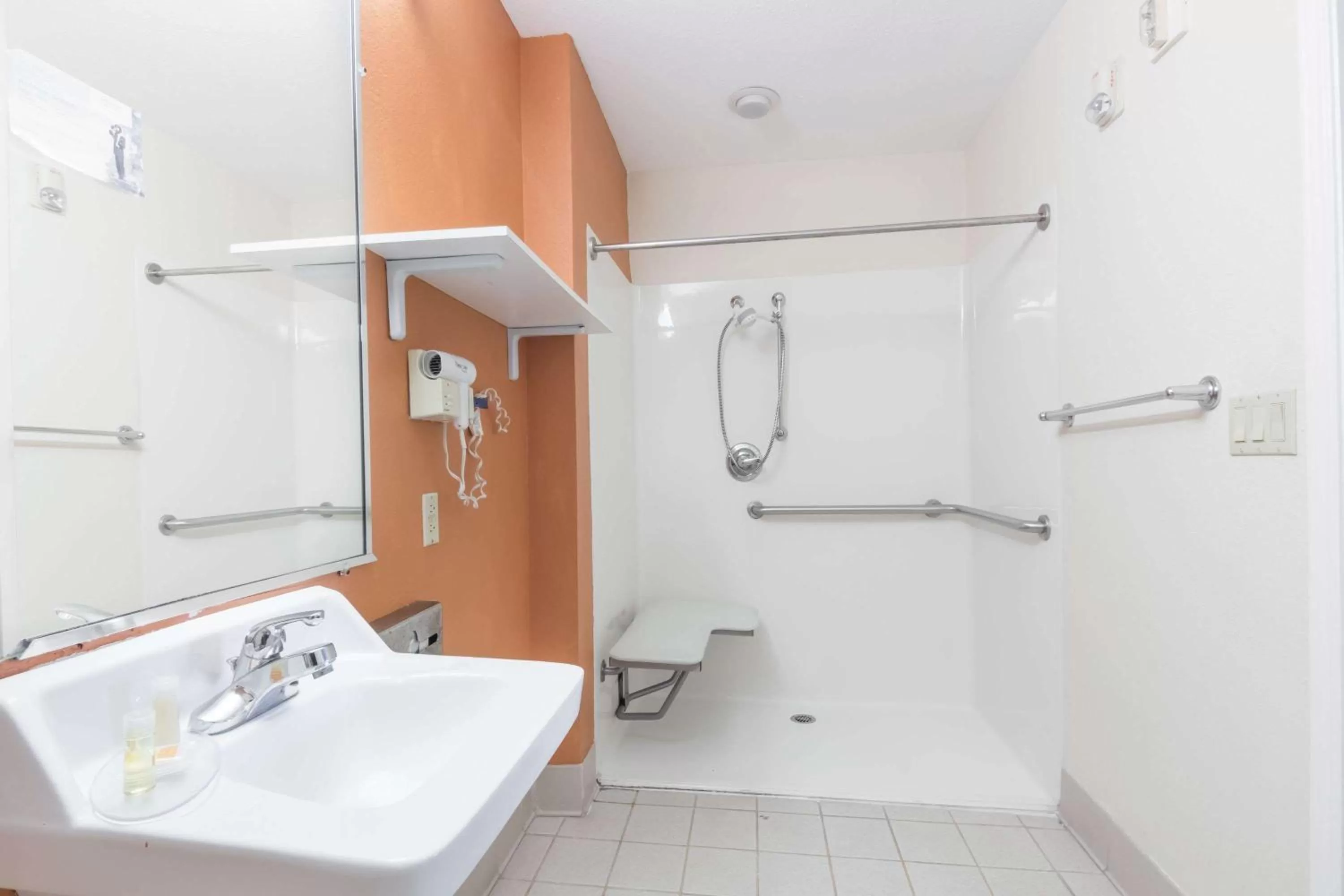 Bathroom in Days Inn & Suites by Wyndham Winnie
