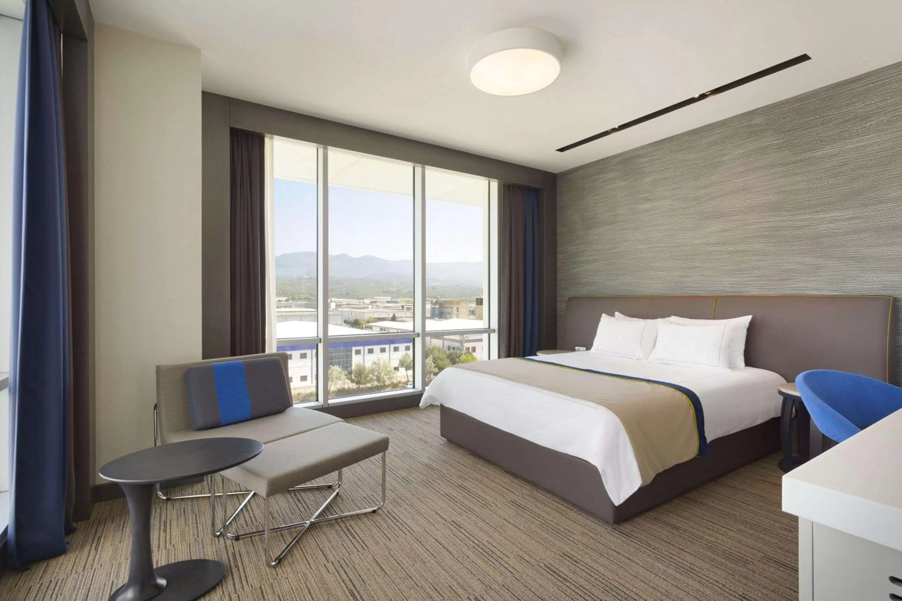 Photo of the whole room, Bed in Ramada Hotel & Suites by Wyndham Izmir Kemalpasa