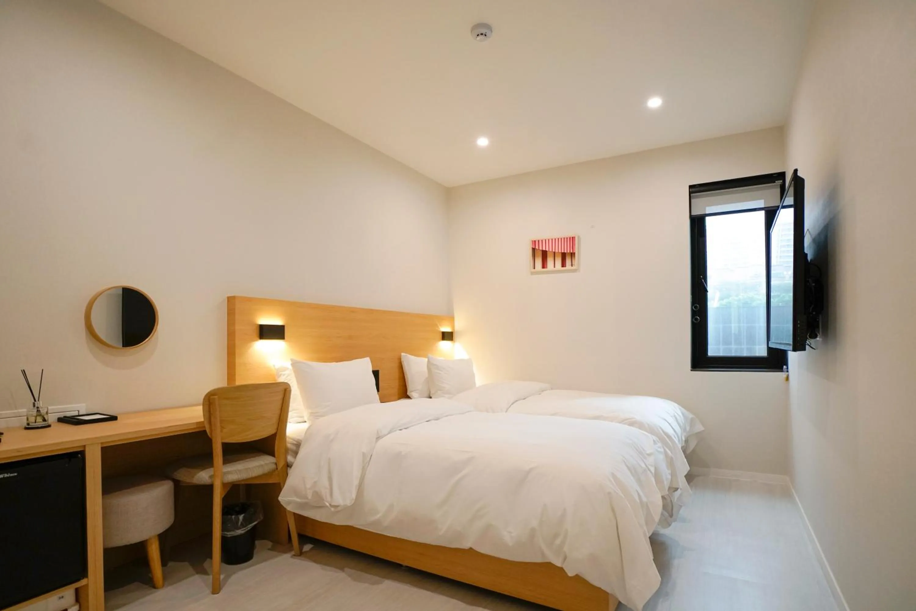 Bed in Mipo Oceanside Hotel