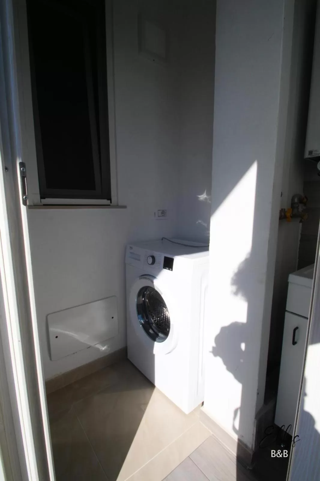 washing machine in B&B Elles con parcheggio interno