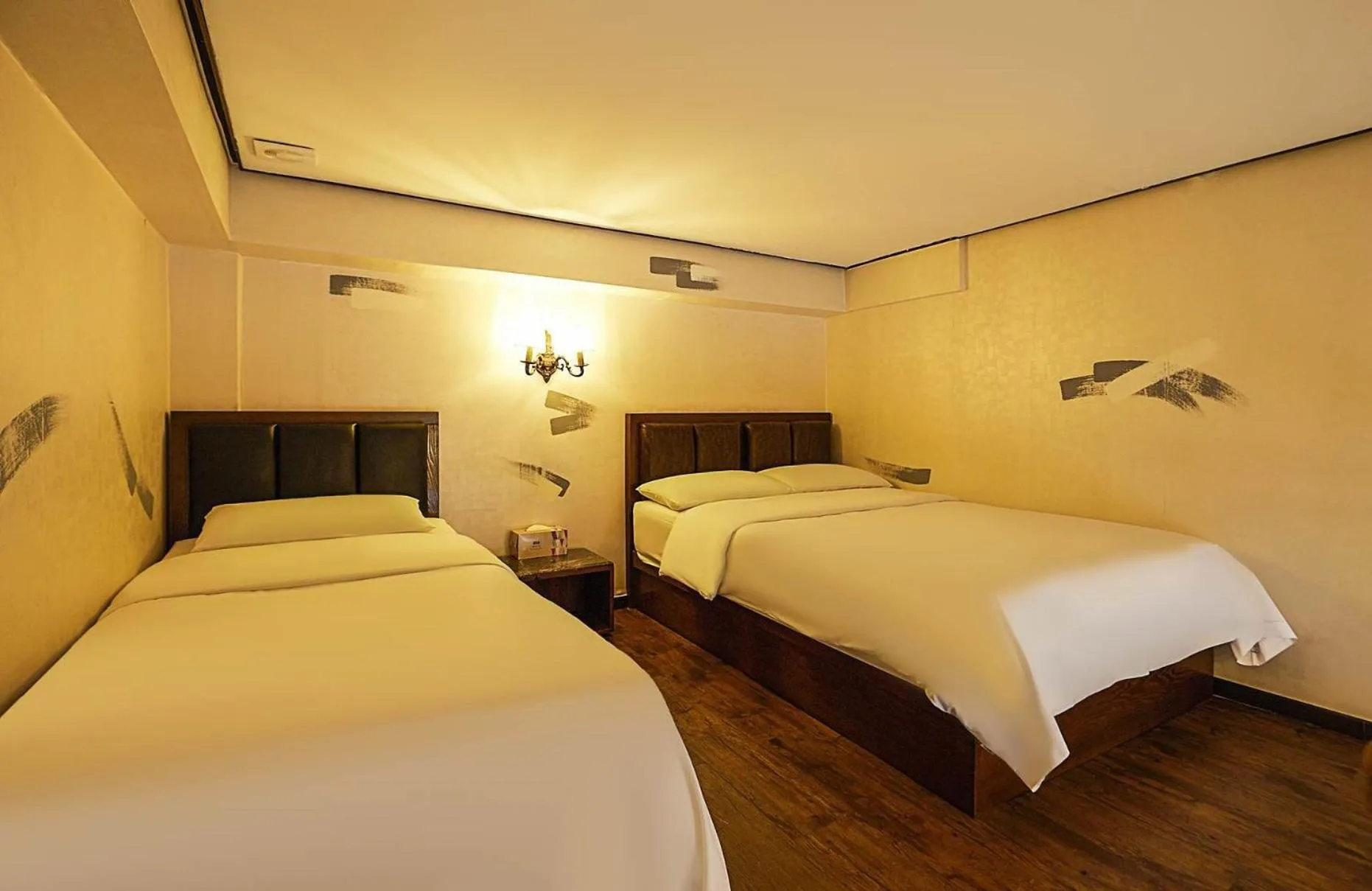 Bed in Friendly DH Naissance Hotel by Mindrum Group