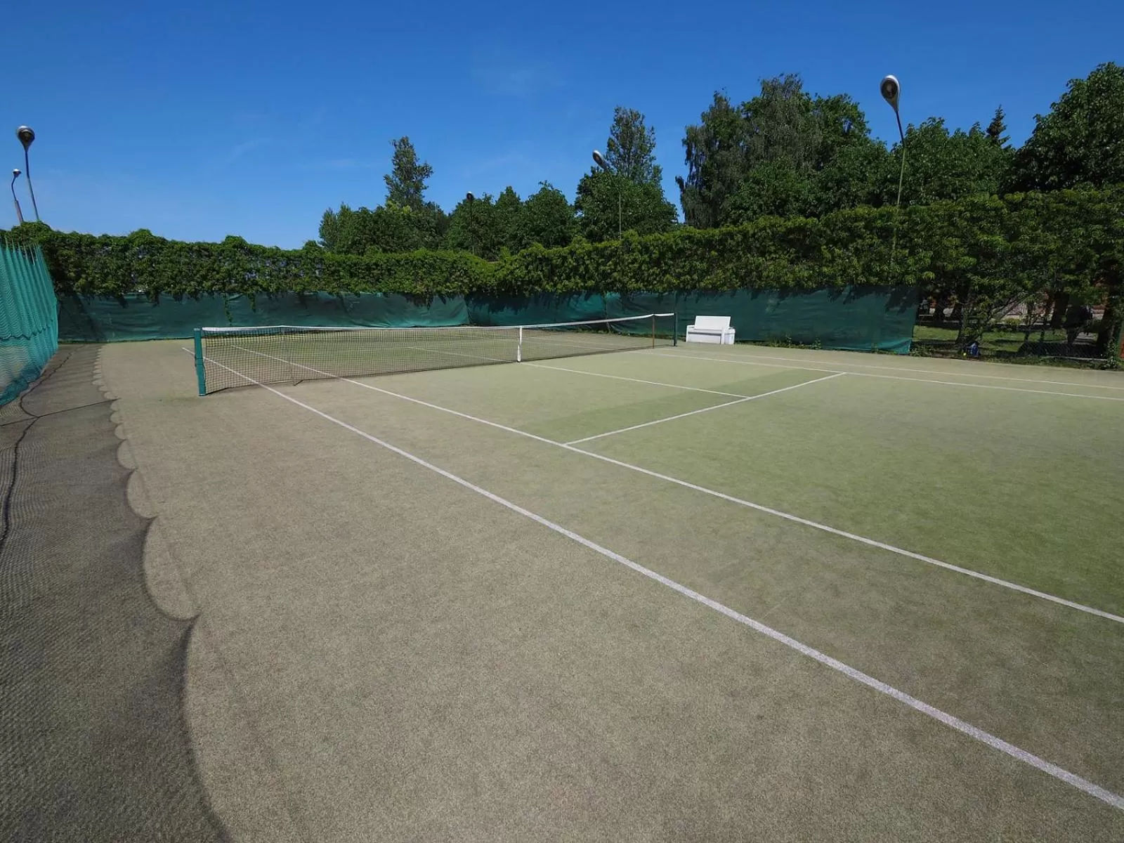 Tennis court in Hotel Mezaparks