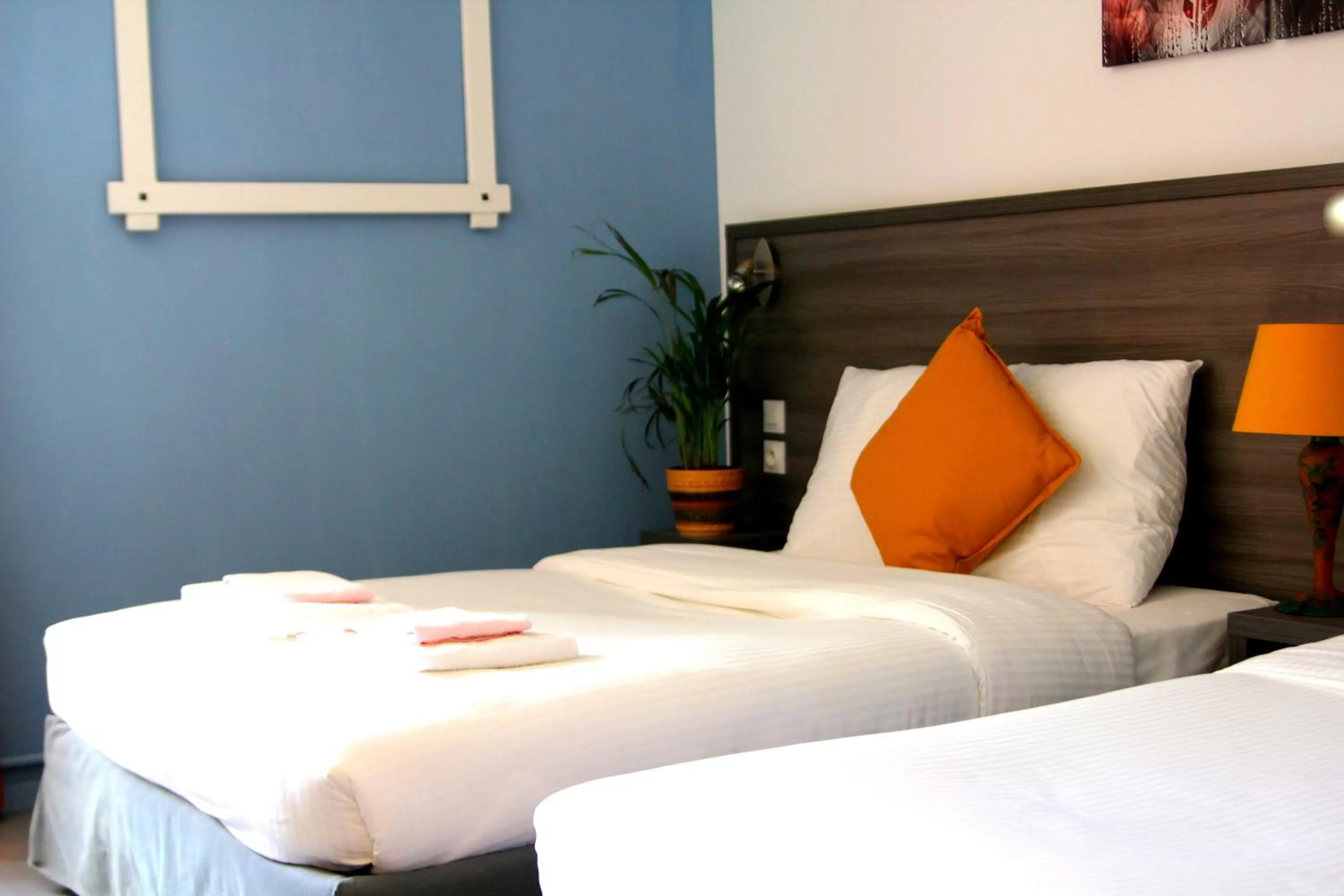 Bed in Logis Hôtel Vuillot