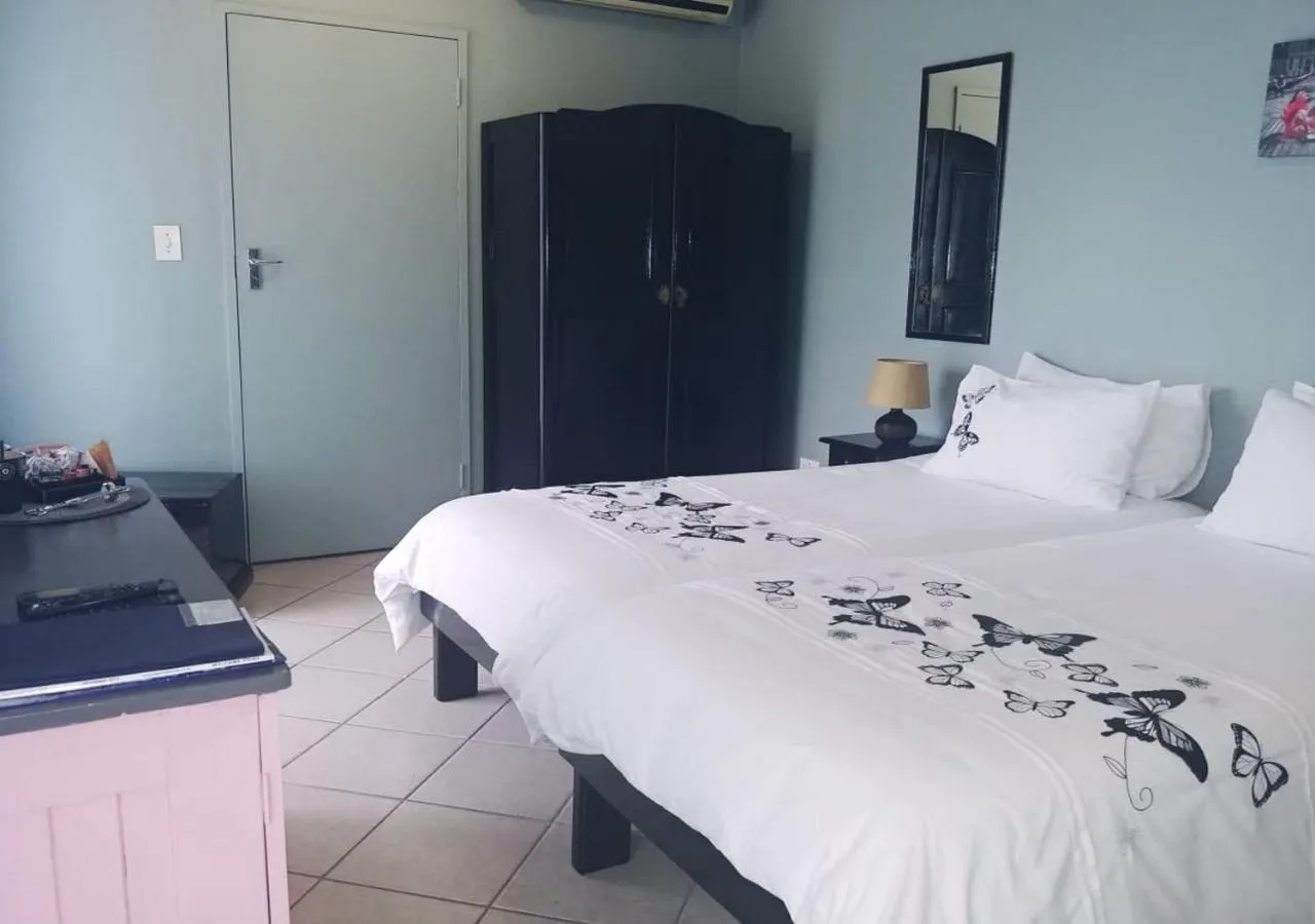 Bed in De Wingerd Wijnland Lodge