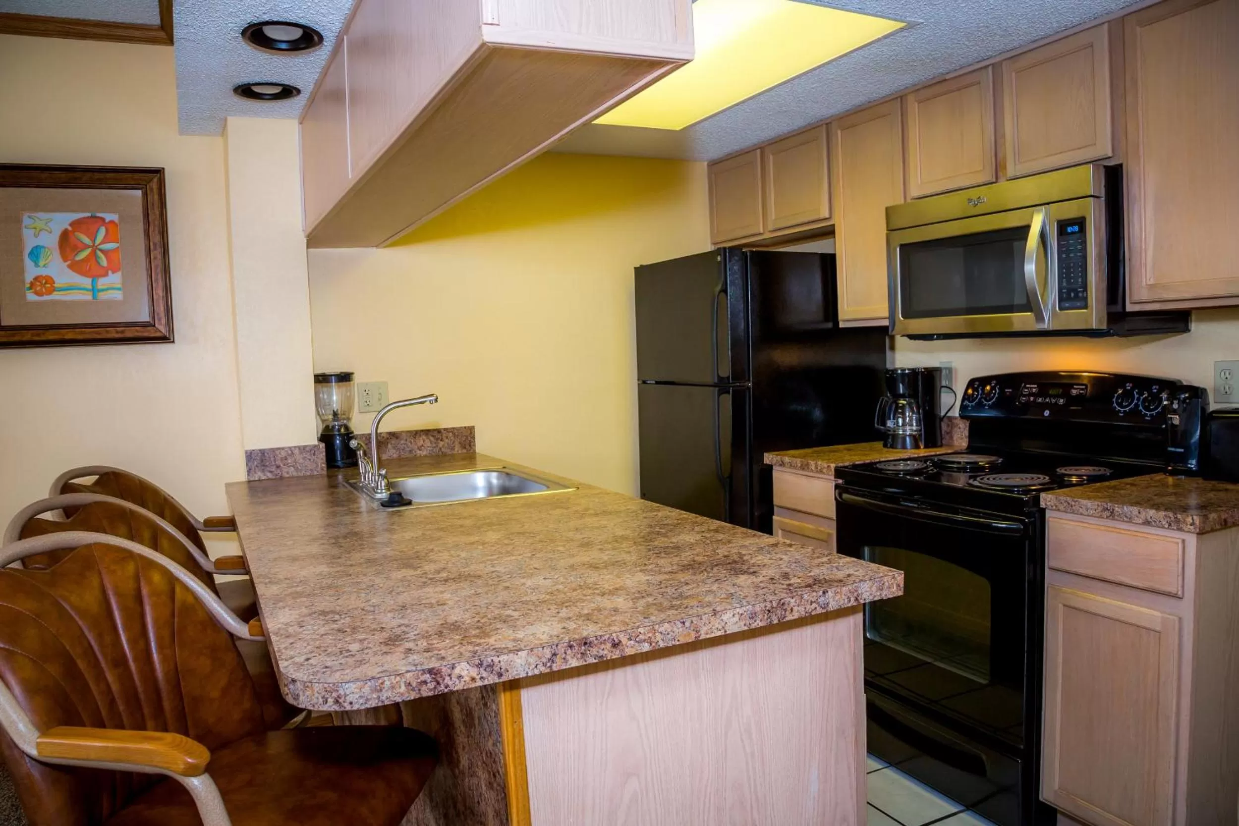 Living room, Kitchen/Kitchenette in Ocean Landings Resort