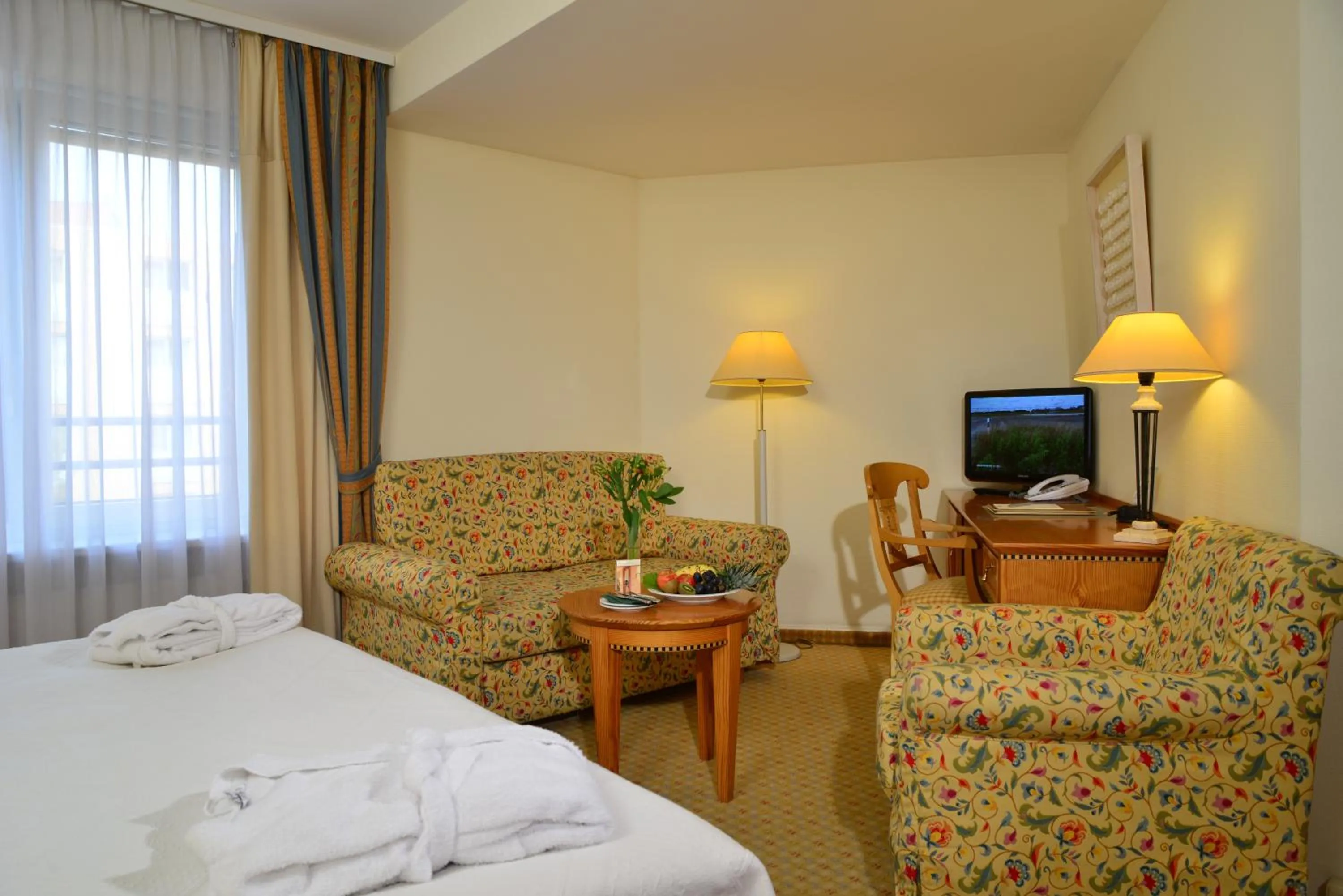 Seating area, Bed in Hotel Domicil Berlin by Golden Tulip