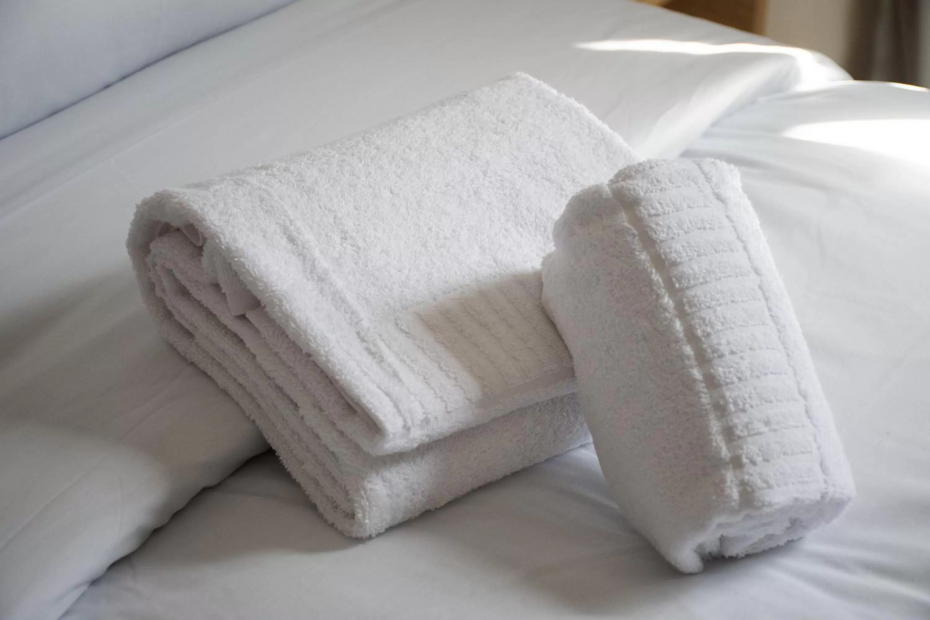 towels, Bed in Karam City Hotel