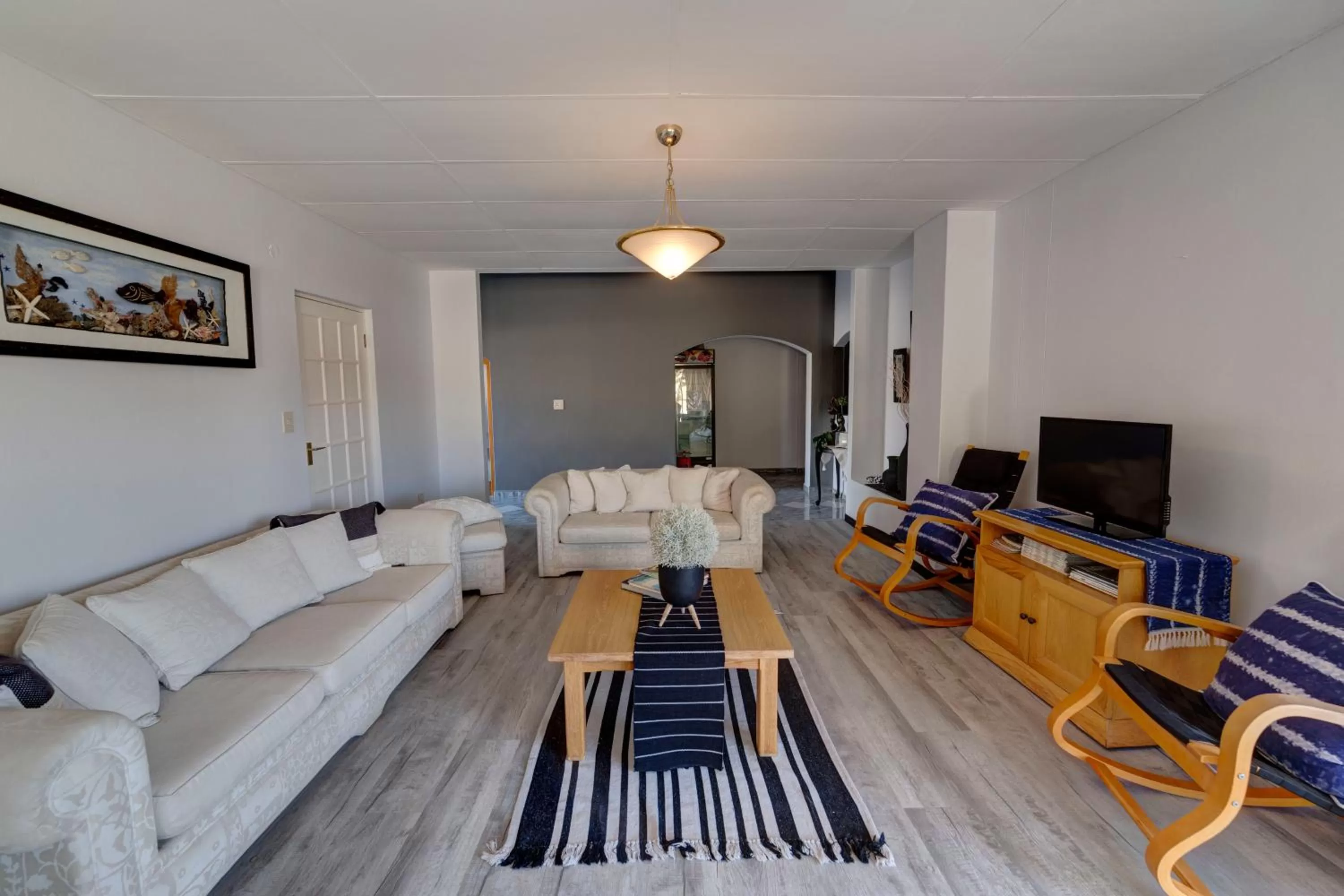 Communal lounge/ TV room, Seating Area in Royal Sea Star Guesthouse