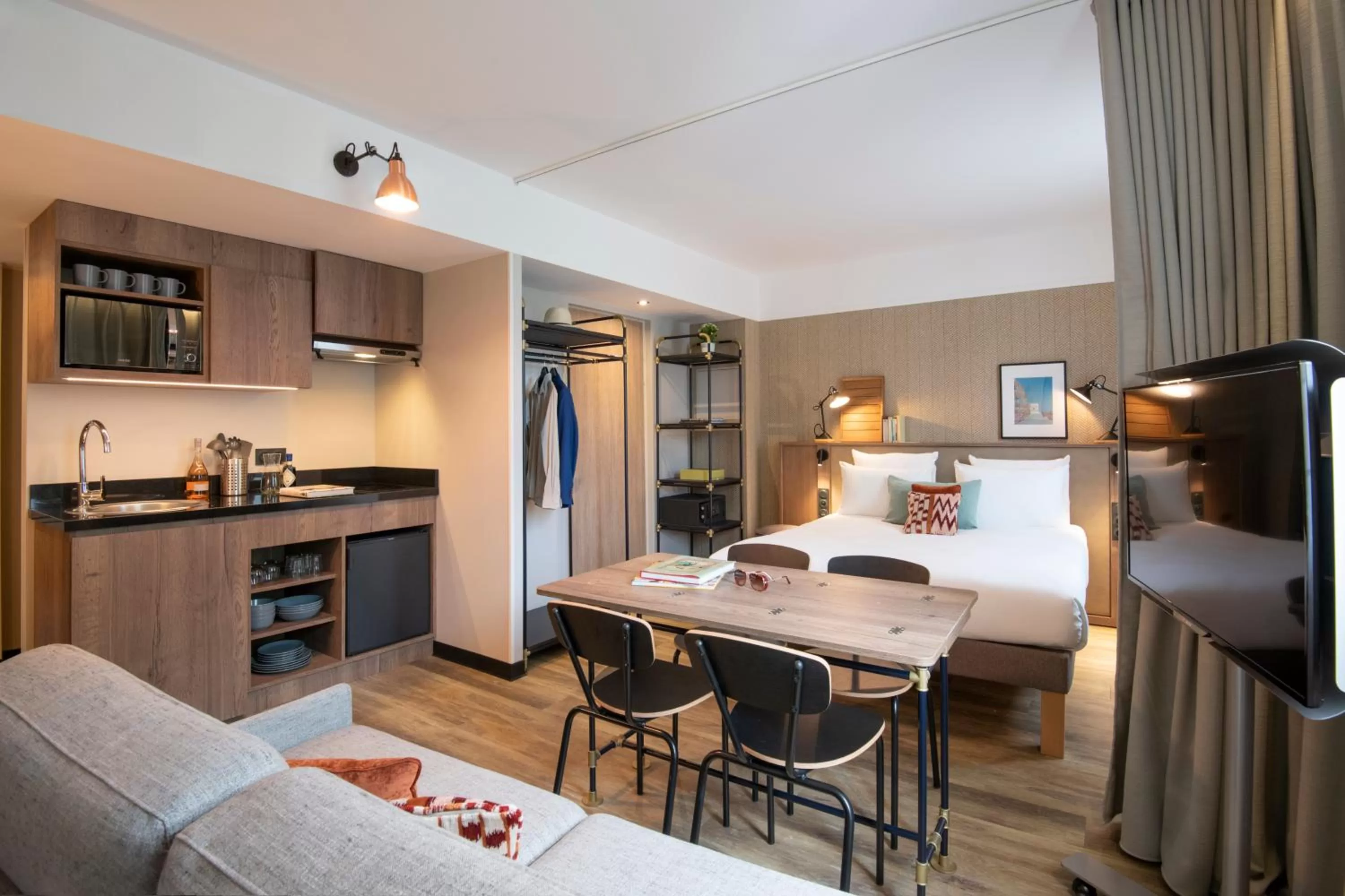 Kitchen or kitchenette, Bed in Novotel Suites Nice Airport