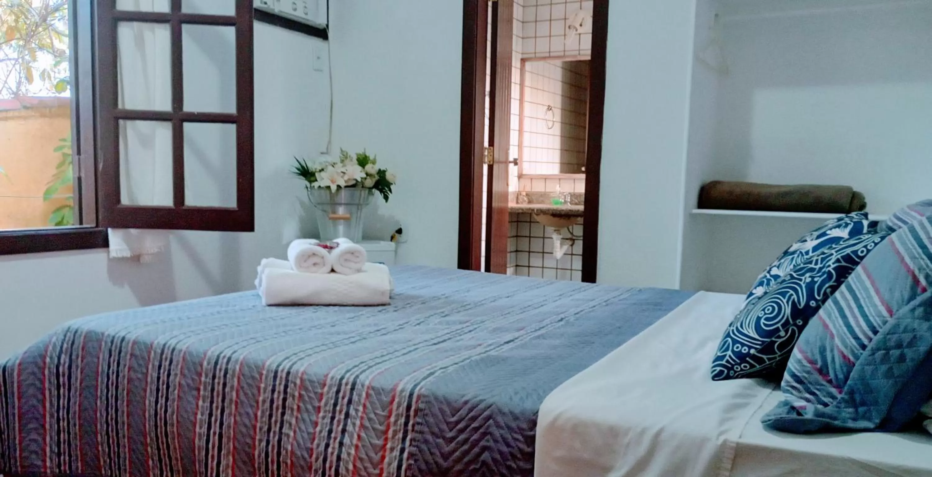 Bed in Hibiscos Pousada