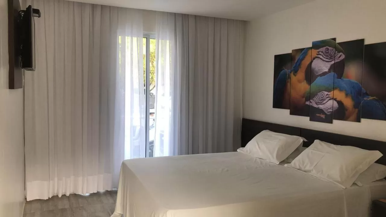 Bed in Pousada Sol e Mar