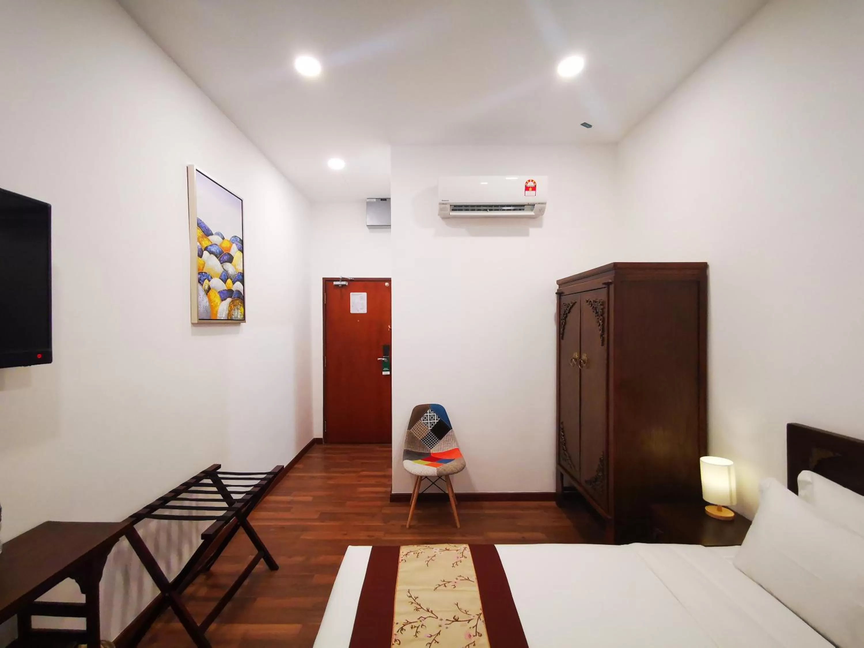 Bed in Mclane Boutique Hotel