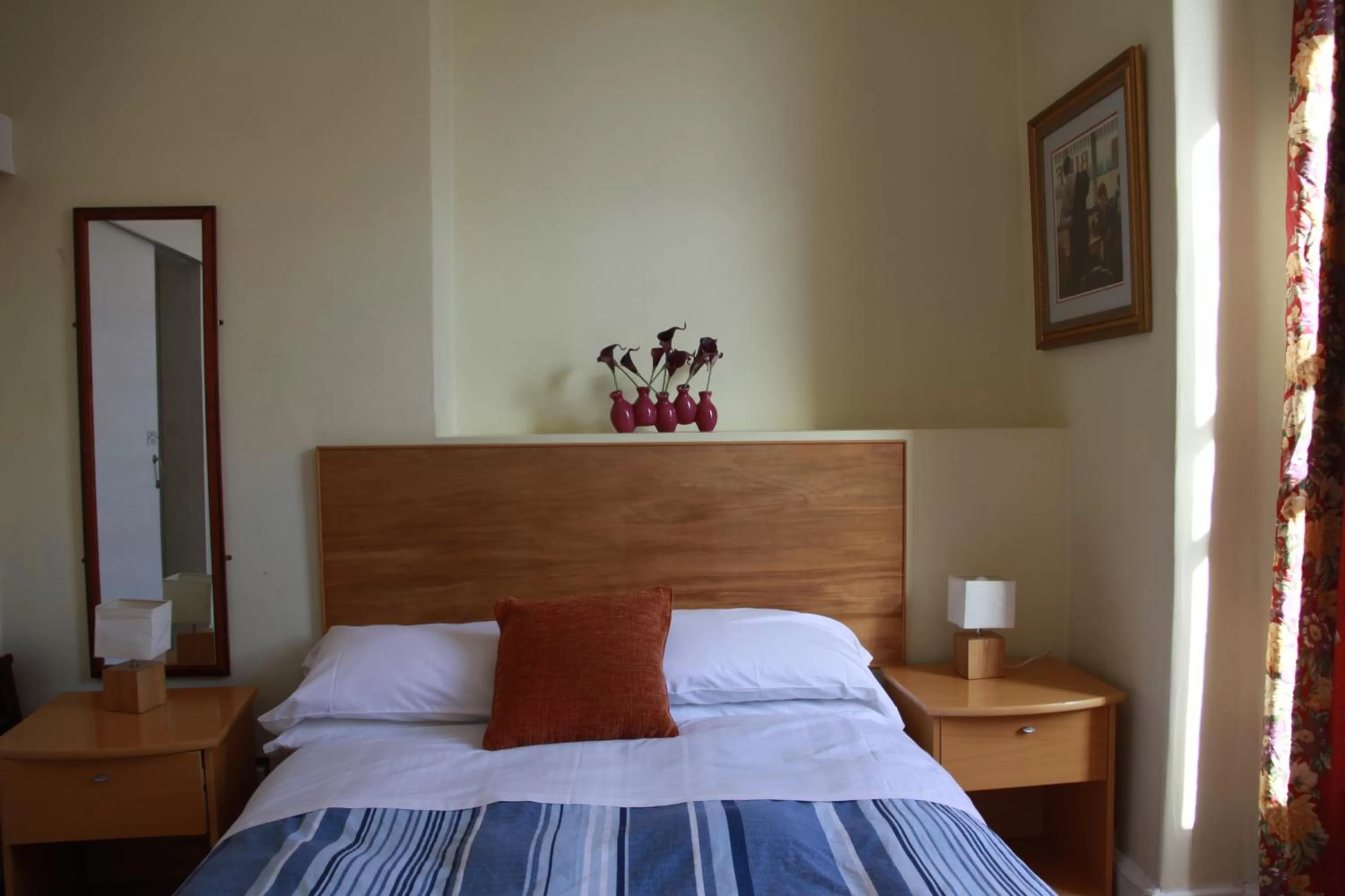 Bed in Ambassador Hotel