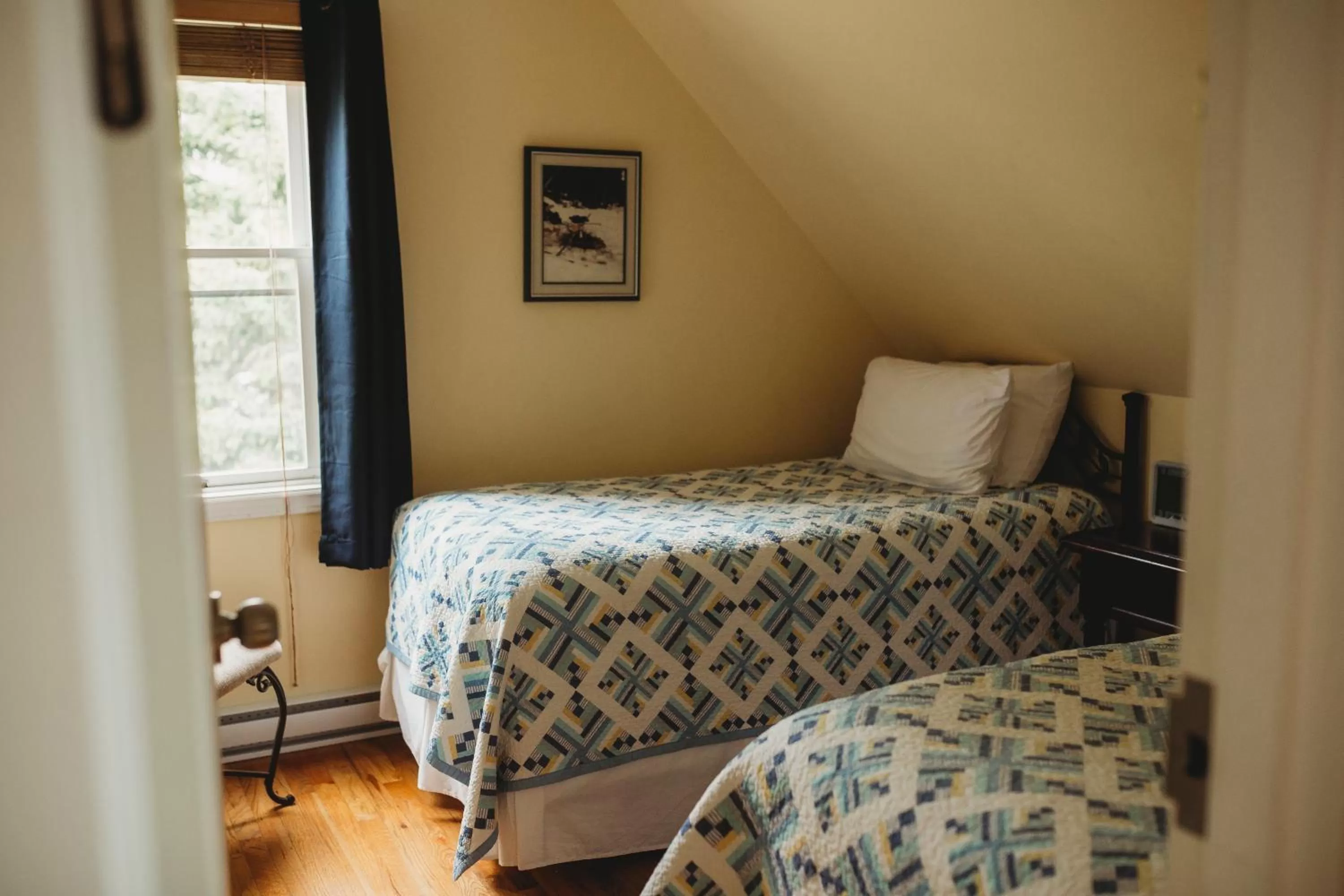 Bedroom, Bed in Carriage House Inn Four and a Half Stars