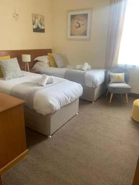 Bed in The Dickens Bar & Inn