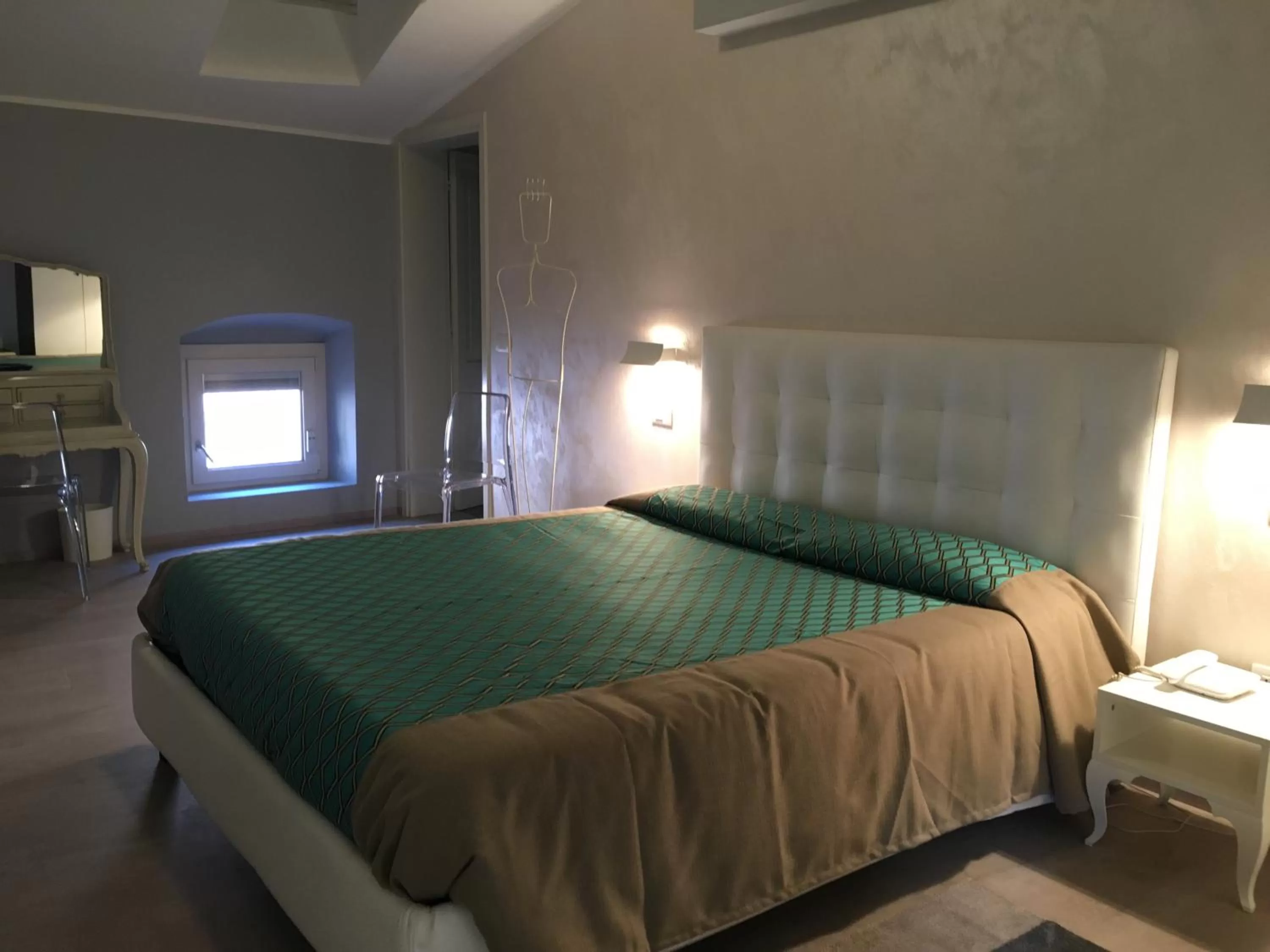 Decorative detail, Bed in Alessi Hotel Trattoria