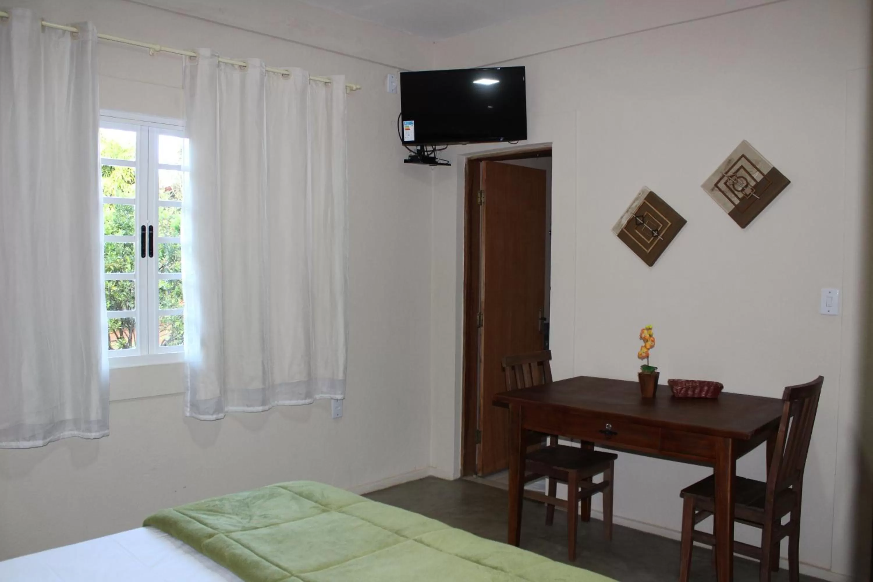 Bed in Pousada Morro dos Ventos