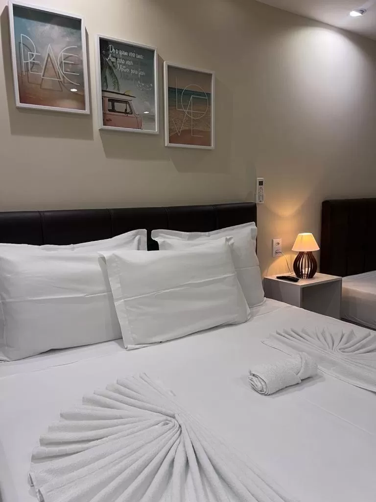 Bed in Pousada Arraial Tropical