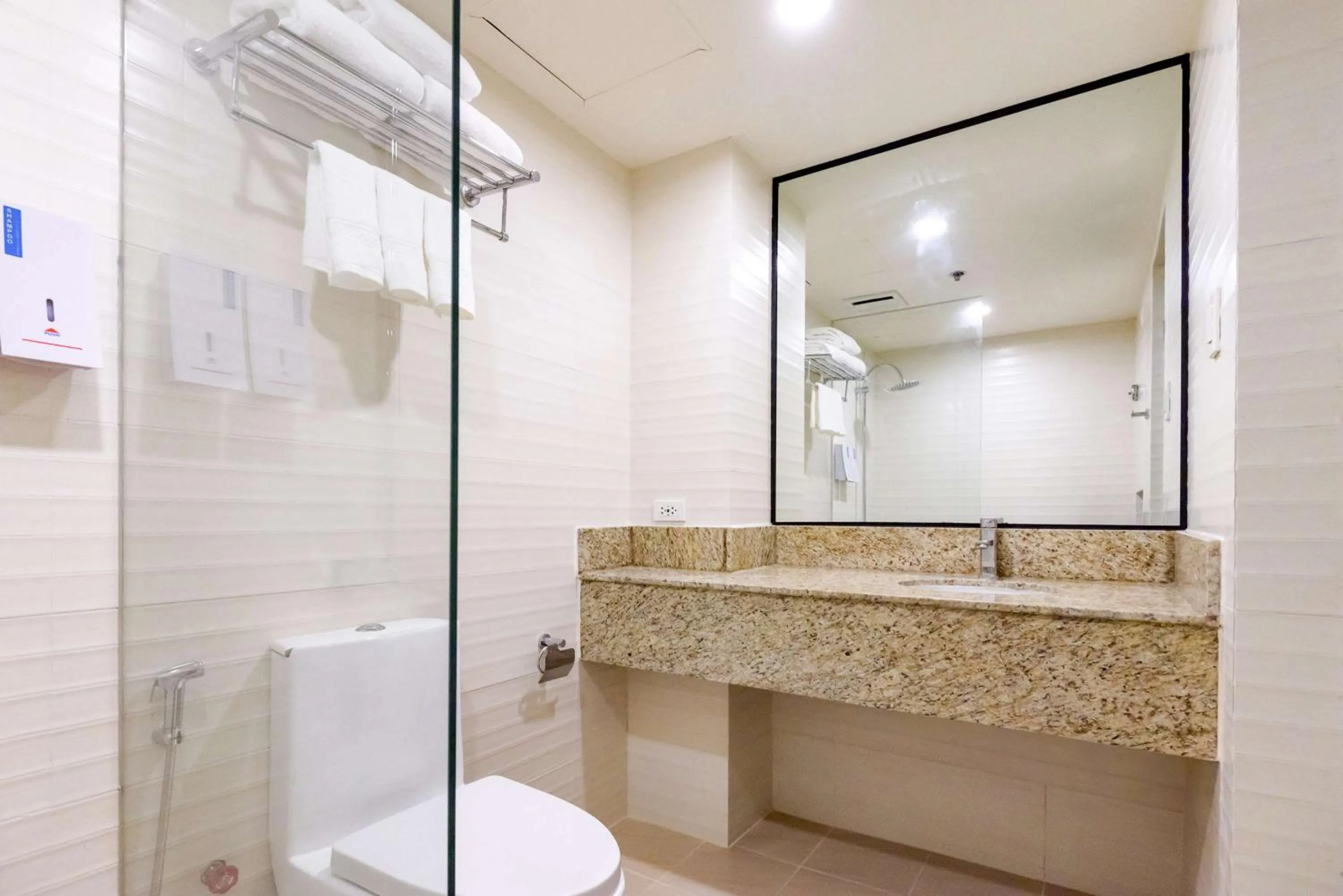 Bathroom in SureStay Plus by Best Western Cebu City