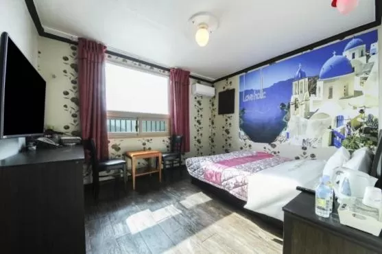 Bed in Saipan Motel with Sea View