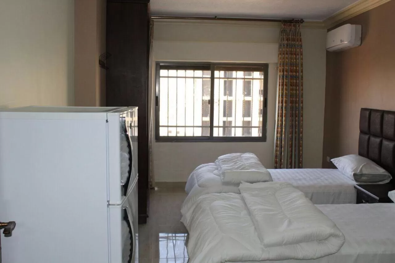 Bed in Al haramain Furnished Apartments