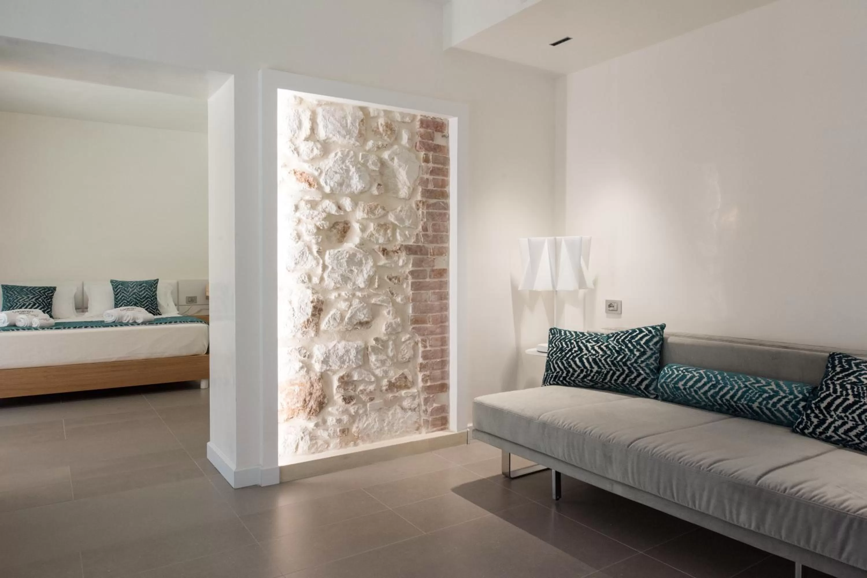 Living room, Bed in Caportigia Boutique Hotel
